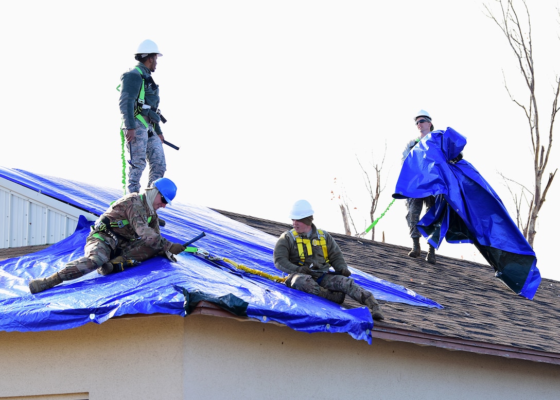 Task Force Phoenix Airmen repair a damaged rooftop at Tyndall Air Force Base, Fla., Nov. 28, 2018. Task Force Phoenix is responsible for large-scale clean up and reconstruction after Hurricane Michael ravaged the 325th Fighter Wing. (U.S. Air Force photo by Senior Airman Isaiah J. Soliz)