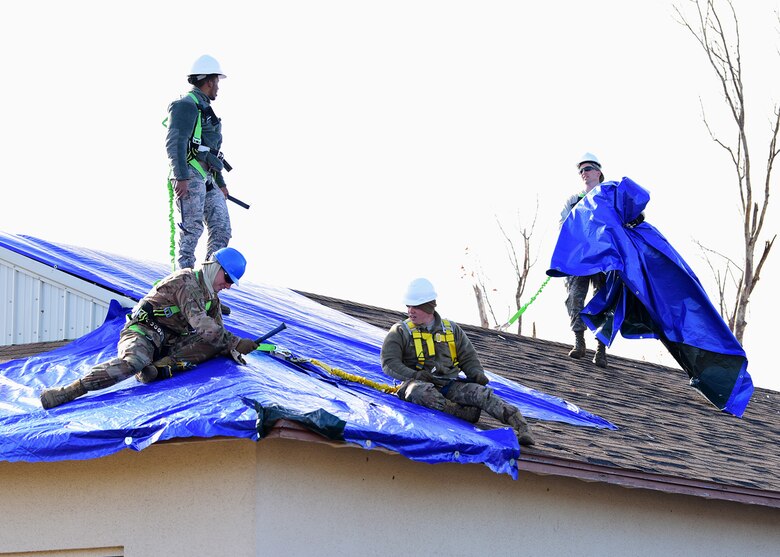 Task Force Phoenix Airmen repair a damaged rooftop at Tyndall Air Force Base, Fla., Nov. 28, 2018. Task Force Phoenix is responsible for large-scale clean up and reconstruction after Hurricane Michael ravaged the 325th Fighter Wing. (U.S. Air Force photo by Senior Airman Isaiah J. Soliz)