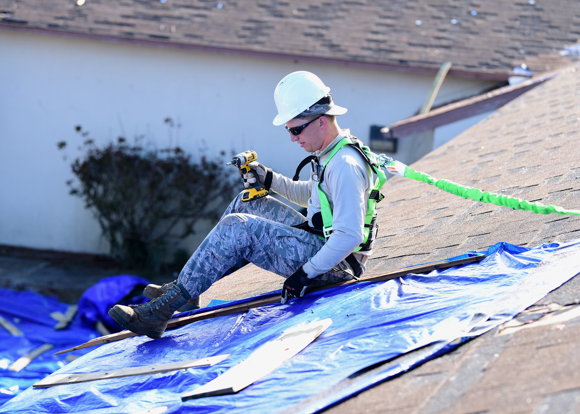Task Force Phoenix member Staff Sgt. Bryce Hesselbacher, repairs a damaged rooftop at Tyndall Air Force Base, Fla., Nov. 28, 2018. Task Force Phoenix is responsible for large-scale clean up and reconstruction after Hurricane Michael ravaged the 325th Fighter Wing. Hesselbacher is deployed from the 436th Civil Engineer Squadron at Dover Air Force Base, De. (U.S. Air Force photo by Senior Airman Isaiah J. Soliz)