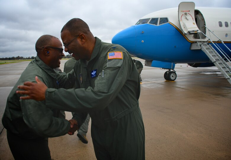 Colonel Esteban L. “Esty” Ramirez, the vice commander of the 932d Airlift Wing, is congratulated by Senior Master Sgt. Dave Brown, following Ramirez's last C-40 aircraft flight with the 932nd Airlift Wing on Nov. 4, 2018, Scott Air Force Base, Ill. He will be transferring to the U.S Transportation Command shortly.  The wing flies the C-40C aircraft and is the premier distinguished visitor airlift operation in the Air Force Reserve Command. With over 1,000 members, the wing equips trains and organizes a ready force of Citizen Airmen to support and maintain all facets of air base operations, involving infrastructure and security.  The unit operates under 22nd Air Force and the Air Force Reserve Command.  (U.S. Air Force photo by Lt. Col. Stan Paregien)