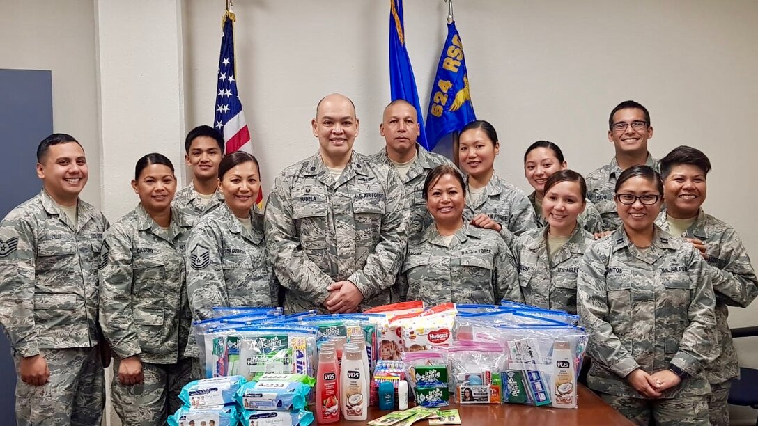 U.S. Air Force Lt. Col. John Tudela, 624th Aerospace Medicine Flight commander, and Airmen from the 624th AMDF in Guam donate hygiene kits Nov. 5, 2018, for Commonwealth Health Center nursing staff in Saipan to help raise morale in the aftermath of Super Typhoon Yutu.
