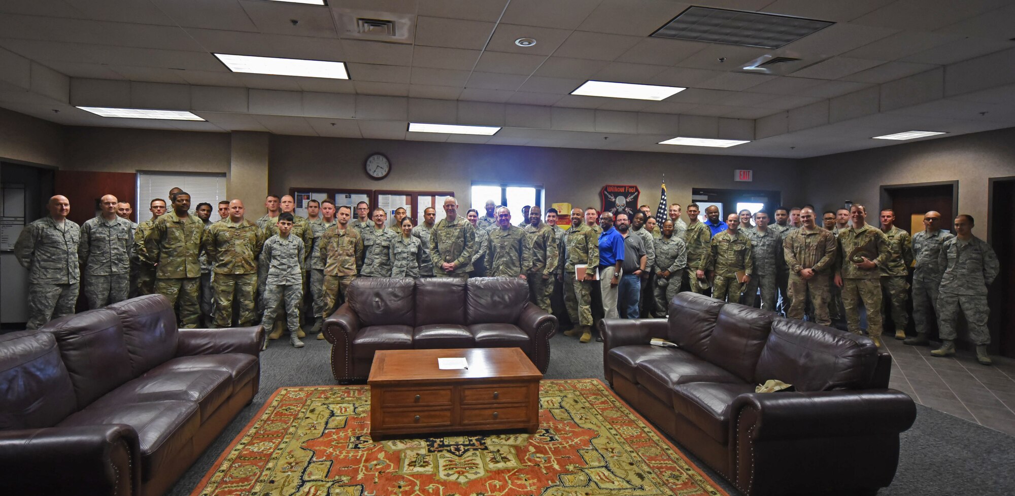 Airmen with the 43rd Air Base Squadron pose for a group photo with Maj. Gen. John R. Gordy II, commander, USAF Expeditionary Center and Command Chief Master Sgt. Kristopher K. Berg, USAF EC command chief at Pope Army Airfield, N.C., Nov. 20, 2018. (U.S. Air Force photo by Tech. Sgt. Jamie Powell)