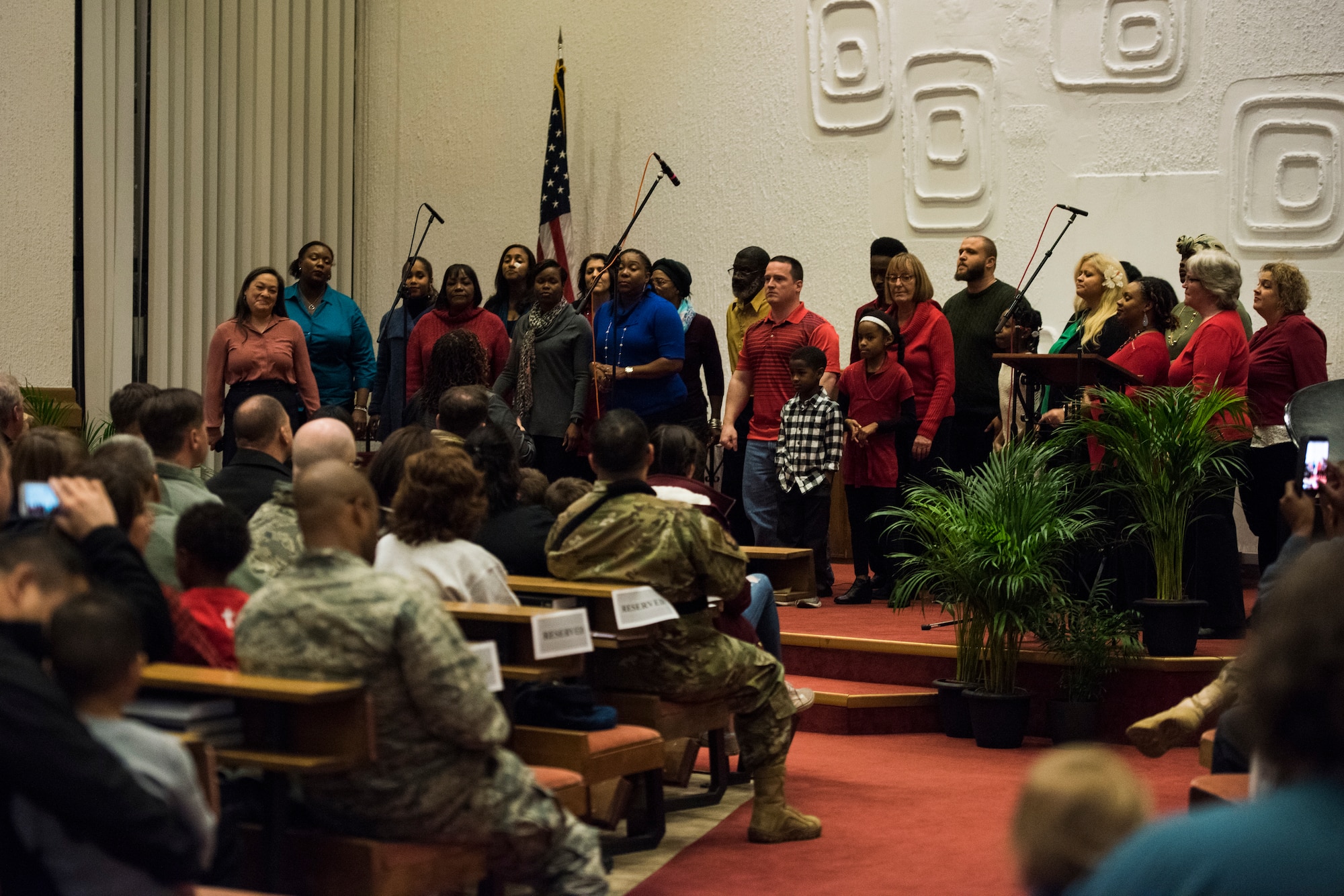 Members of the Ramstein Combined Choir sing during the annual Christmas Tree Lighting Ceremony on Ramstein Air Base, Germany, Nov. 27, 2018. The ceremony has been held since 2010, when the city of Ramstein-Miesenbach gave the Christmas tree to the base as a gift. (U.S. Air Force photo by Senior Airman Devin M. Rumbaugh)