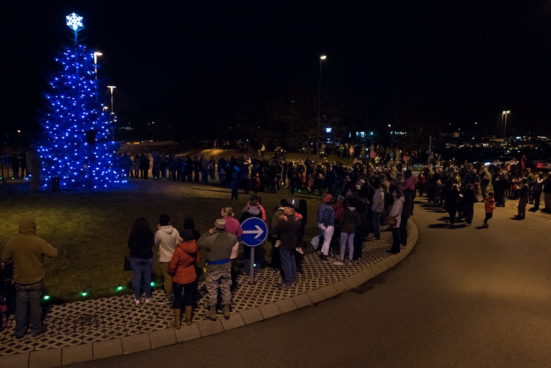 Members of the Kaiserslautern Military Community gather at the annual Ramstein Christmas Tree lighting Ceremony on Ramstein Air Base, Germany, Nov. 27, 2018. The Christmas tree was given to the base by the city of Ramstein-Miesenbach in 2010. (U.S. Air Force photo by Senior Airman Devin M. Rumbaugh)