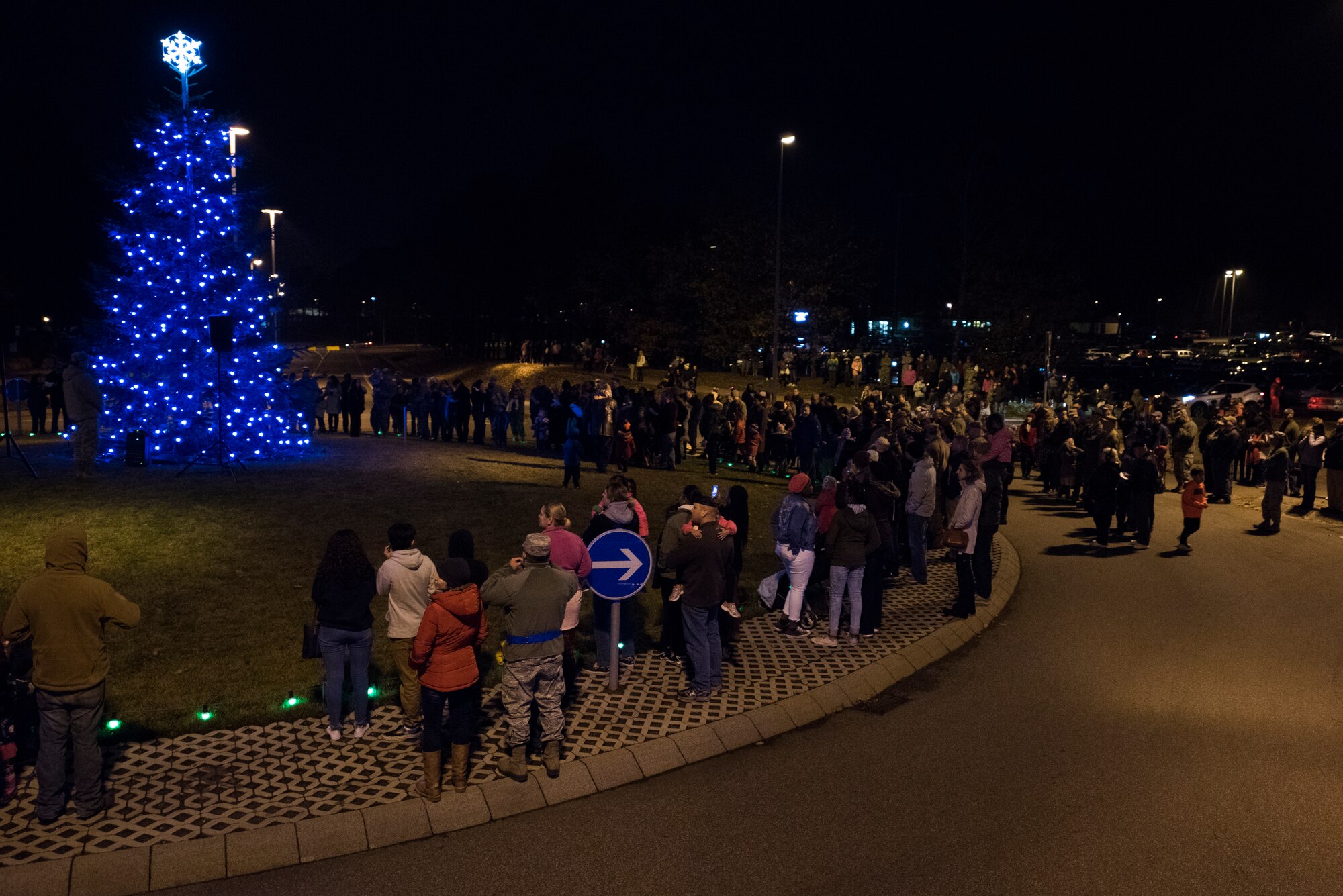 Members of the Kaiserslautern Military Community gather at the annual Ramstein Christmas Tree lighting Ceremony on Ramstein Air Base, Germany, Nov. 27, 2018. The Christmas tree was given to the base by the city of Ramstein-Miesenbach in 2010. (U.S. Air Force photo by Senior Airman Devin M. Rumbaugh)