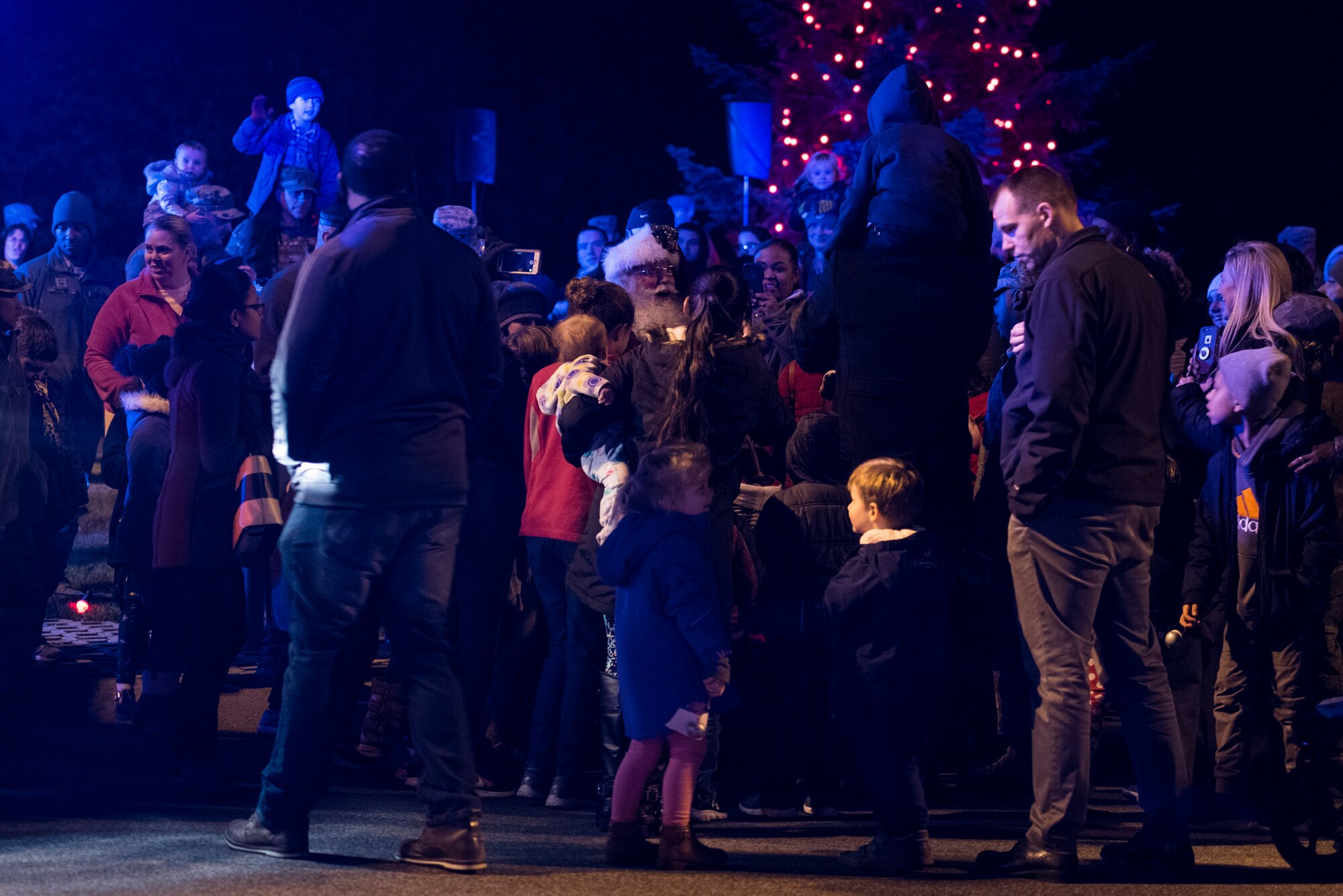 Members of the Kaiserslautern Military Community join Santa Claus during the annual Ramstein Christmas Tree Lighting Ceremony on Ramstein Air Base, Germany, Nov. 27, 2018. Claus arrived on a fire engine, handed out candy, and took photos with the children. (U.S. Air Force photo by Senior Airman Devin M. Rumbaugh)