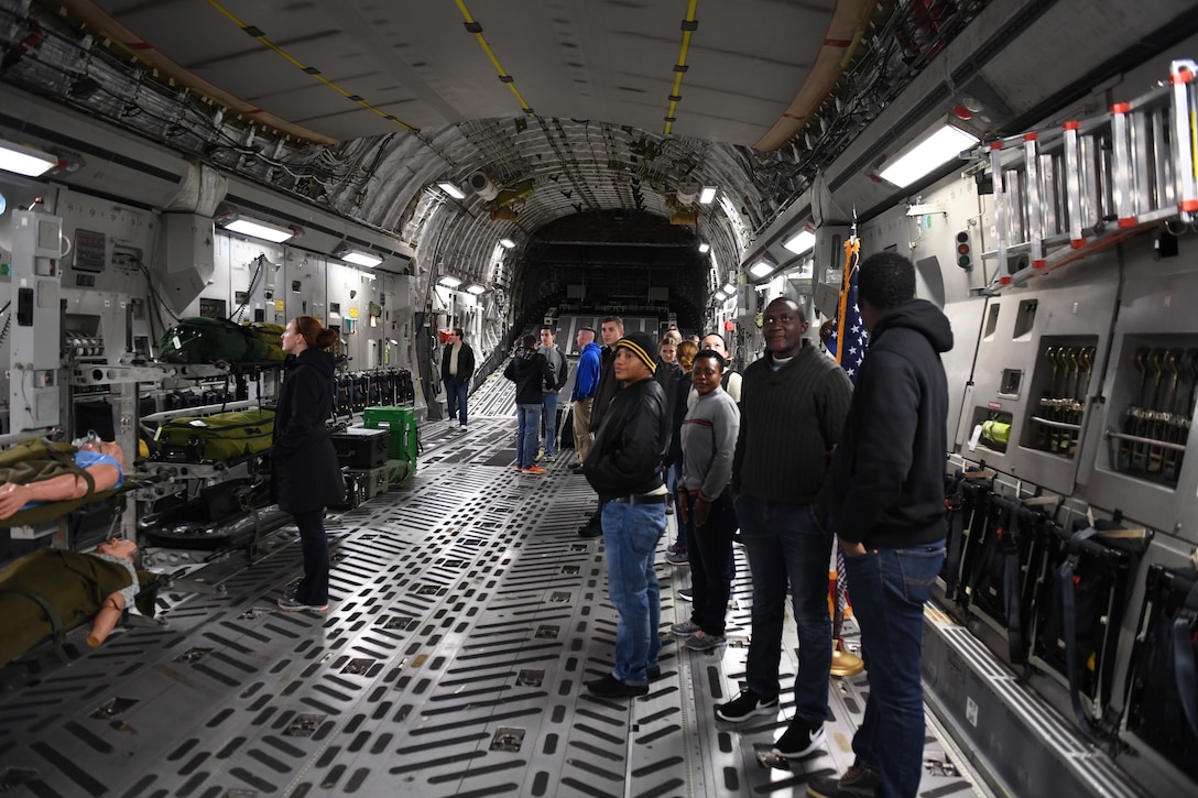 Members of the delayed entry program walk through a C-17 Globemaster III on Nov. 3, 2018 at Pittsburgh International Airport Air Reserve Station, Pennsylvania. The delayed entry program allows recruits to attend unit training activities and prepares them for basic military training. (U.S. Air Force photo by Staff Sgt. Zachary Vucic)