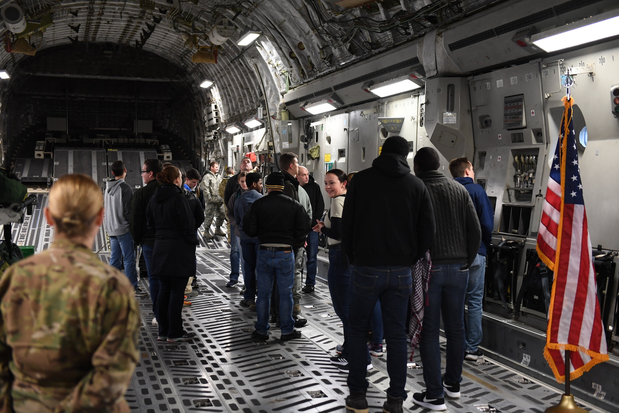 Members of the delayed entry program walk through a C-17 Globemaster III on Nov. 3, 2018 at Pittsburgh International Airport Air Reserve Station, Pennsylvania. The delayed entry program allows recruits to attend unit training activities and prepares them for basic military training. (U.S. Air Force photo by Staff Sgt. Zachary Vucic)