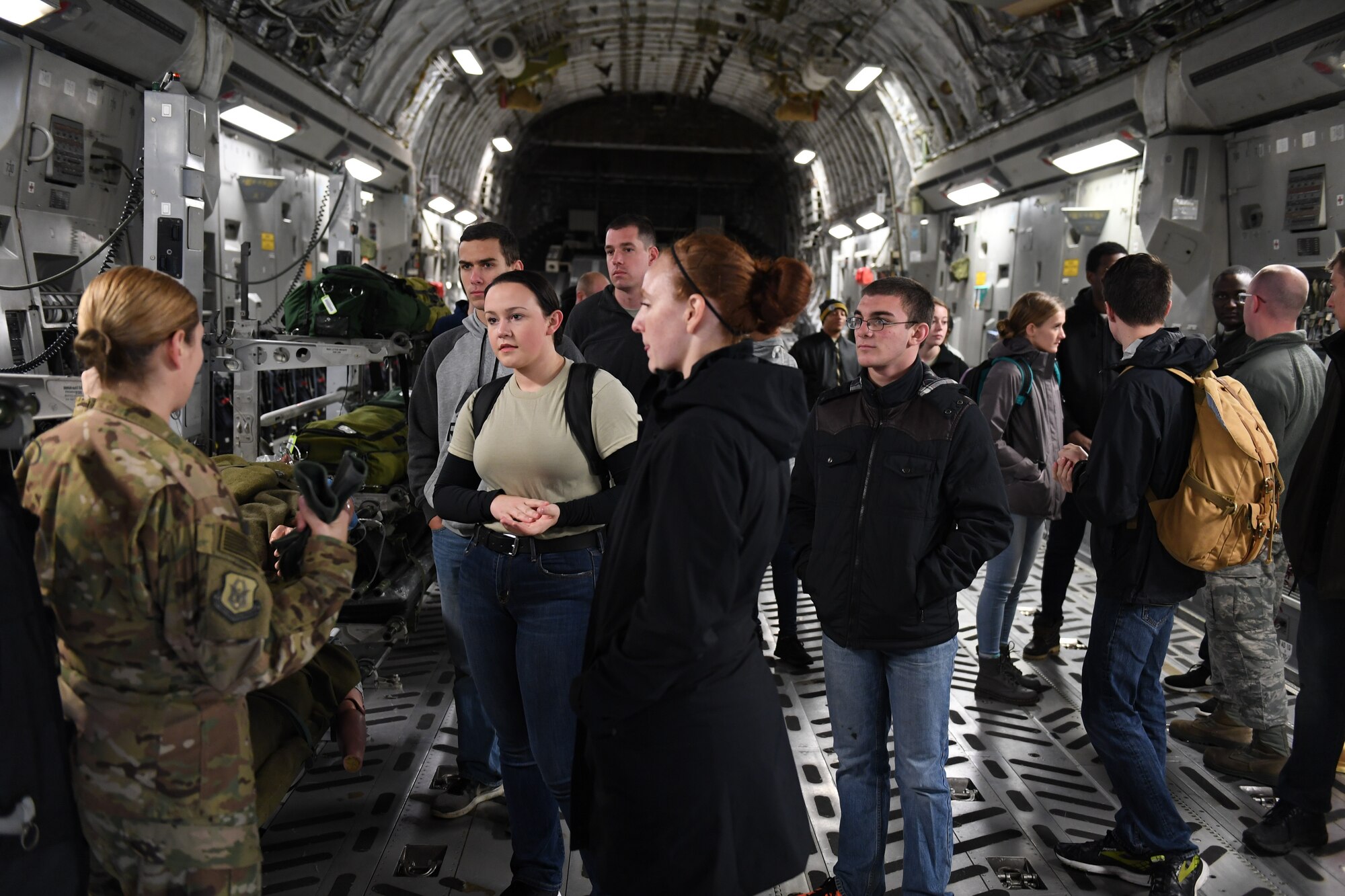 Members of the delayed entry program walk through a C-17 Globemaster III on Nov. 3, 2018 at Pittsburgh International Airport Air Reserve Station, Pennsylvania. The delayed entry program allows recruits to attend unit training activities and prepares them for basic military training. (U.S. Air Force photo by Staff Sgt. Zachary Vucic)