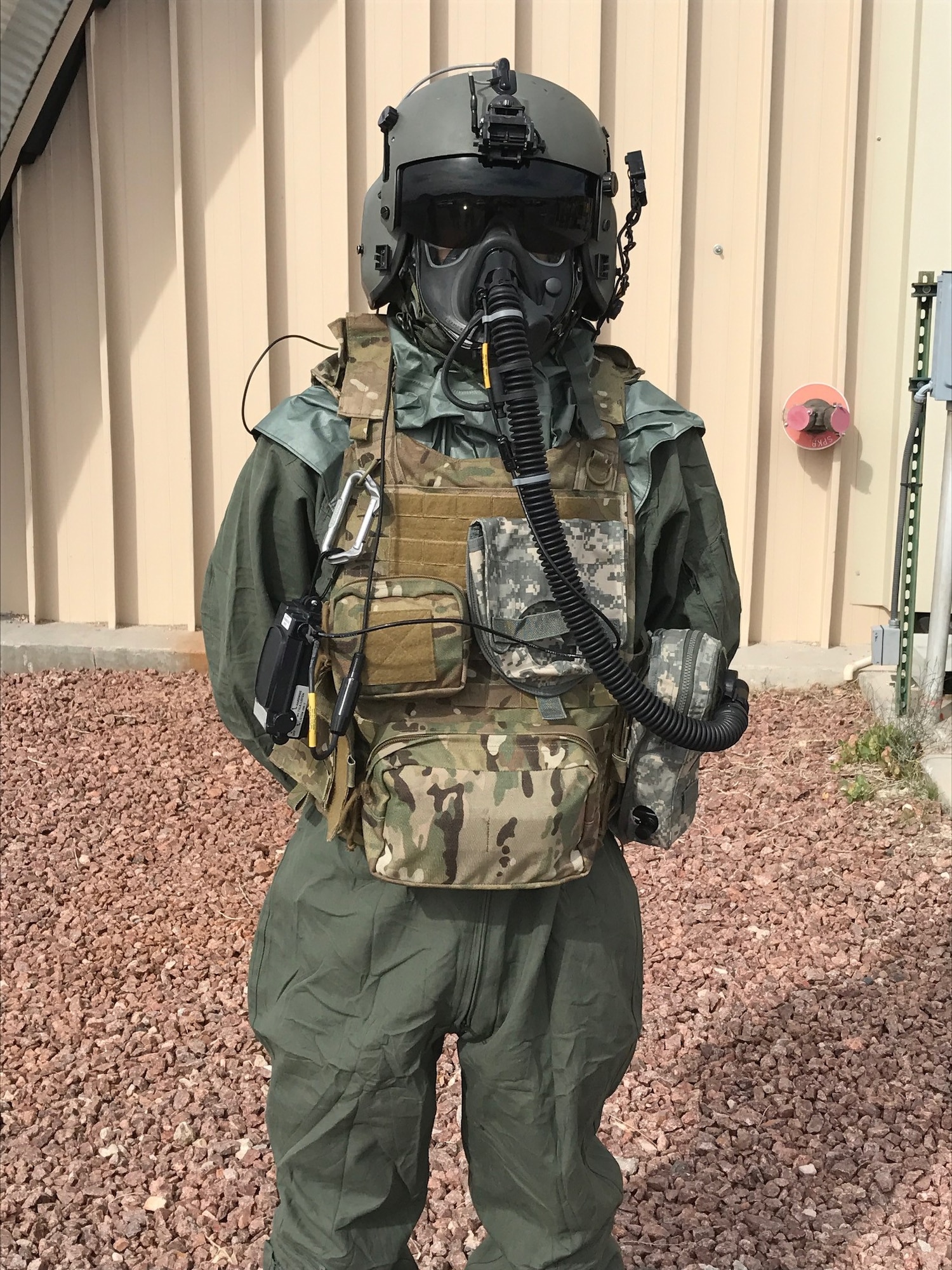 An Airman demonstrates the use of the next-generation chemical, biological, radiological and nuclear protective mask known as the Joint Service Aircrew Mask - Rotary Wing during a test and fielding event.