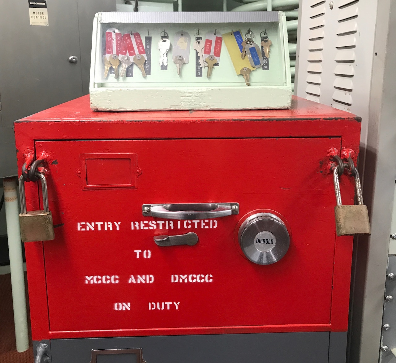 A red padlocked safe inside the launch control center.