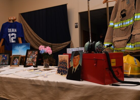 Photos and mementos of the Dean family are displayed near the entrance of a vigil hosted November 28, 2018, in St. Timothy’s Catholic Church, Manvel, North Dakota. Staff Sgt. Anthony James Dean, his wife Chelsi Kay Dean, and their two children Kaytlin Merie Dean, 5, and Avri James Dean, 1, were all killed in a vehicle accident during the Thanksgiving holiday near Billings, Montana. The family only recently were stationed at Grand Forks Air Force Base, moving to North Dakota in May of 2018. (U.S. Air Force photo by Airman 1st Class Elora J. Martinez)