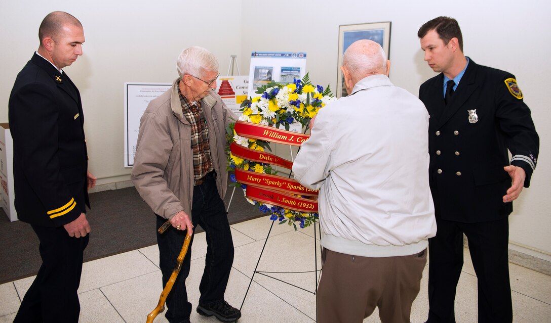 Retired Fire Chief Neil Mangan and retired Fire Capt. Forest Green place a wreath Nov. 21, 2018, in remembrance of Wright-Patterson Air Force Base, Ohio, firefighters who died in the line of duty. Mangan and Green both were among those that battled a blaze Nov. 21, 1961, which killed two of their fellow firefighters. Chase McGrath, 788th Civil Engineering Squadron district fire chief and Steven McKee, International Association of Firefighters Local F88 secretary/treasurer, assisted in the wreath laying. (U.S. Air Force photo by R.J. Oriez)