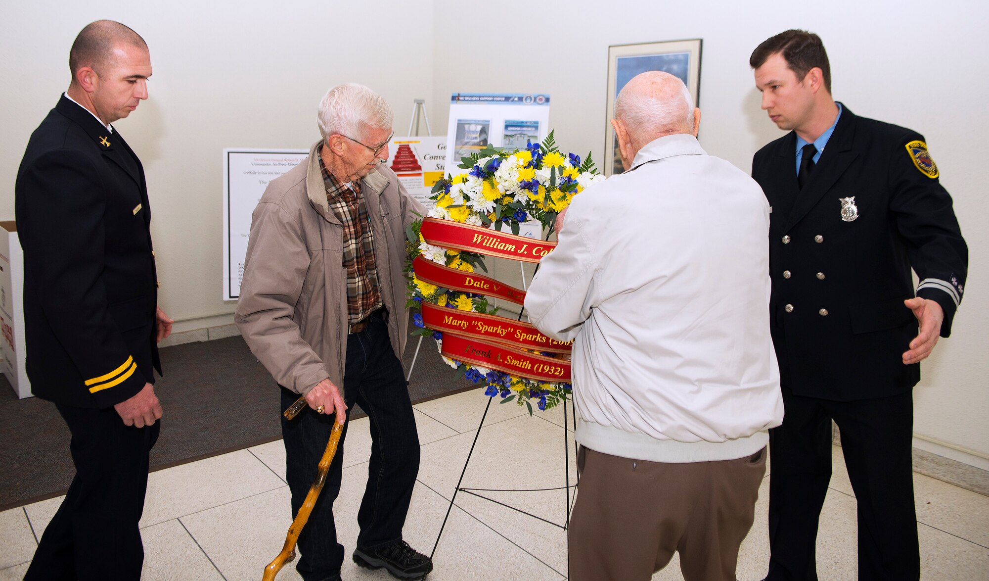 Retired Fire Chief Neil Mangan and retired Fire Capt. Forest Green place a wreath Nov. 21, 2018, in remembrance of Wright-Patterson Air Force Base, Ohio, firefighters who died in the line of duty. Mangan and Green both were among those that battled a blaze Nov. 21, 1961, which killed two of their fellow firefighters. Chase McGrath, 788th Civil Engineering Squadron district fire chief and Steven McKee, International Association of Firefighters Local F88 secretary/treasurer, assisted in the wreath laying. (U.S. Air Force photo by R.J. Oriez)
