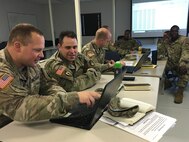 Members of the 110th Chemical Battalion that comprises Task Force 110 met during a small-group break-out for DoD Defense CBRN Response Force (DCRF) training at Fort Hood, Texas, Nov. 29, 2018. The 110th is based at Joint-Base Lewis-McCord, Wash. A JTF-CS Mobile Training Team (MTT) covered a variety of topics in logistics, legal, medical, personnel movement, collaborative tools, media engagement and the 2-year plan for the DCRF. (DoD photo by Air Force Lt. Col. Karen Roganov, director of JTF-CS Public Affairs/ released)