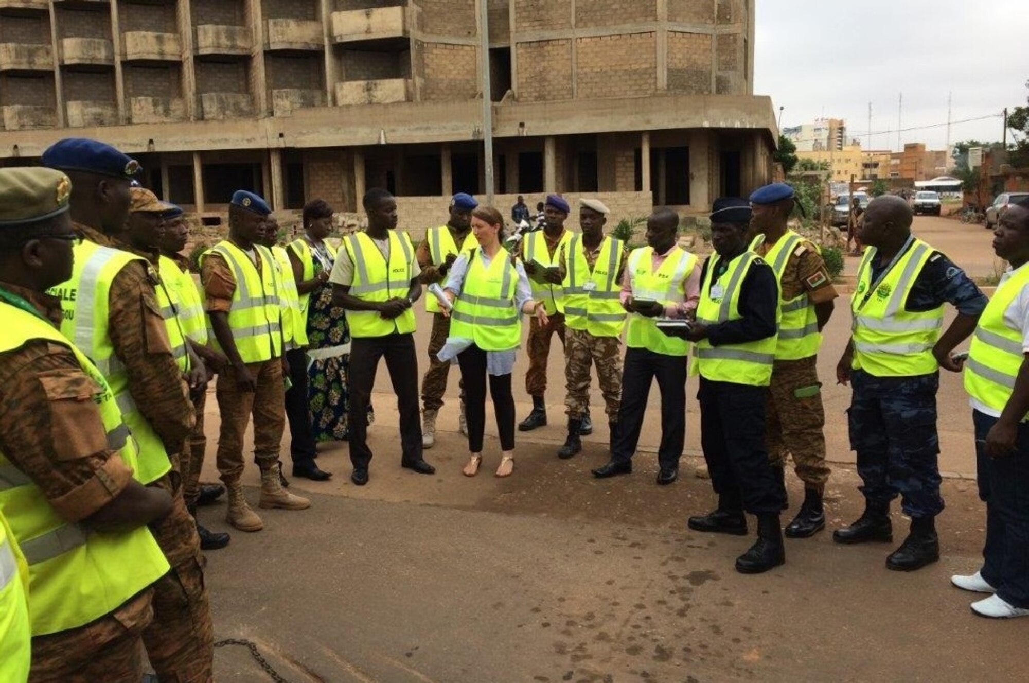 AFOSI Special Agent Helen Marino, center, while assigned to the 25th Expeditionary Field Investigations Squadron, is shown interacting with AFOSI security partners in Burkina Faso. (Photo submitted by SA Helen Marino)
