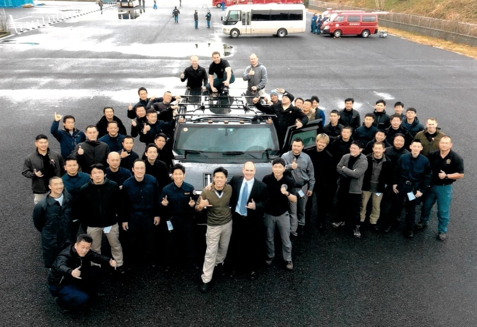 Tactical Law Enforcement officers (SWAT equivalent) from police departments Japan-wide are pictured during Advanced Law Enforcement Rapid Response Training (ALERRT) as part of a joint effort by OSI and the FBI. OSI Special Agent Paul Sorci, Detachment 622, Tokyo, Japan, is standing out of the driver's door. (Photo submitted by SA Paul Sorci)