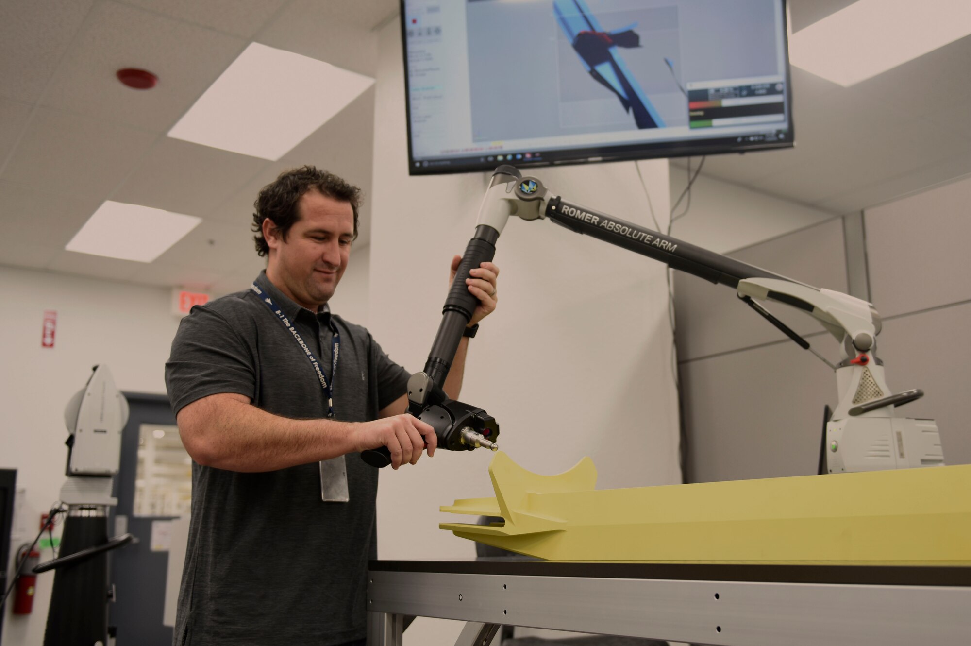 Kyle Taylor, 76th Commodities Maintenance Group engineer, demonstrates material scanning during a tour of the Reverse Engineering and Critical Tooling at Tinker Air Force Base, Oklahoma, Nov. 20, 2018. Tinker's largest organization is the Oklahoma City Air Logistics Complex. It is the largest of three depot repair complexes in Air Force Material Command and provides depot maintenance on the KC-135 Stratotanker, B-1 Lancer, B-52 Stratofortress, E-3 Sentry and E-6 Mercury aircraft. (U.S. Air Force photo byAirman 1st Class Jesenia Landaverde)