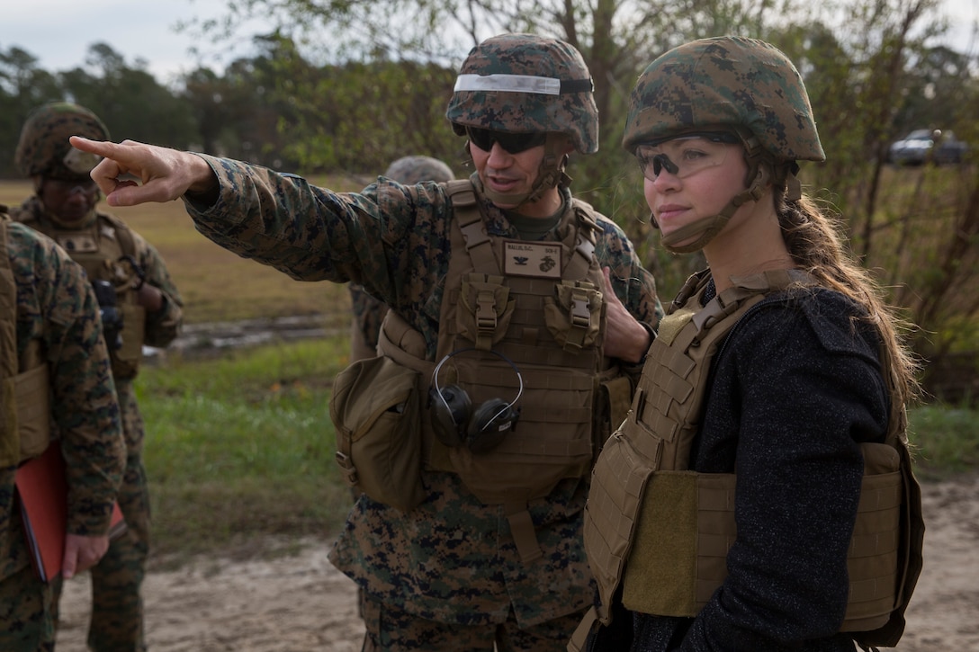 Kristen Johnson, military legislative assistant to Senator Tom Cotton of Arkansas, observes training at the School of Infantry-East with Col. David C. Wallis, commanding officer of SOI-E, at Camp Geiger, N.C., Nov. 26, 2018. Johnson traveled to Camp Lejeune to observe different elements of the Marine Air-Ground Task Force’s expeditionary capabilities and to become familiar with the structure of the United States Marine Corps. (U.S. Marine Corps photo by Cpl. Taylor W. Cooper)