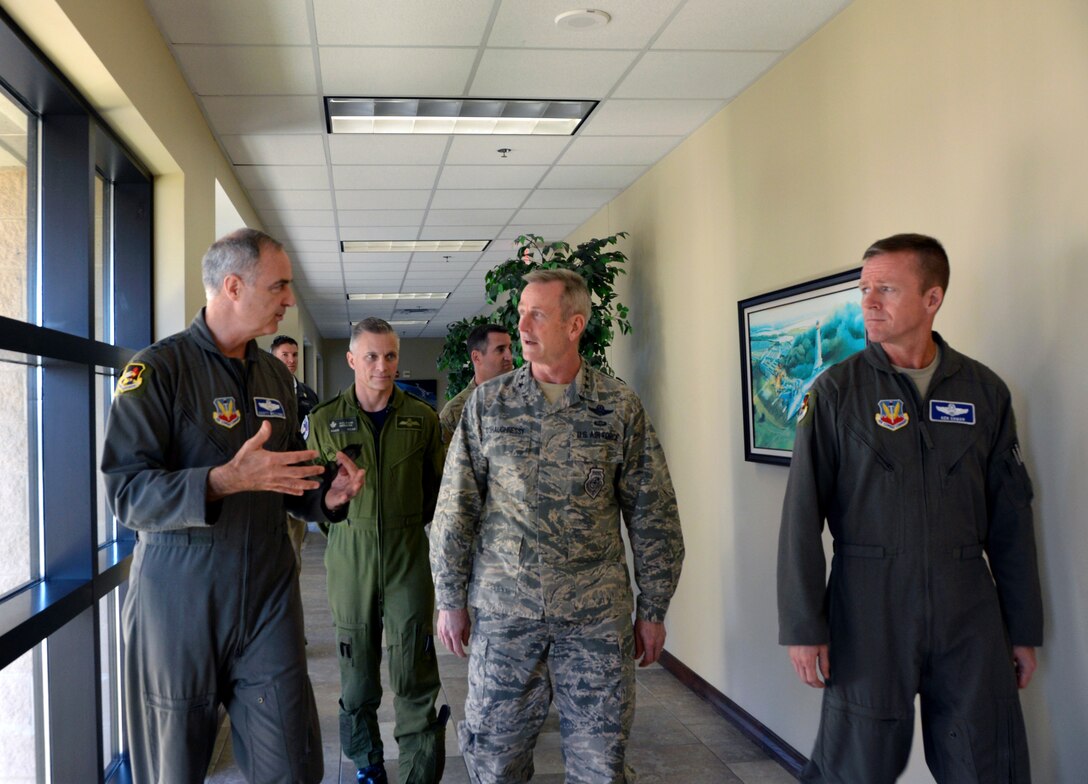 Lt. Gen. R. Scott Williams, 1st Air Force (Air Forces Northern) – Continental U.S. NORAD Region Commander, discusses Gen. Terrence O’Shaughnessy, Commander, Northern American Aerospace Defense Command and U.S.  Northern Command, about 1st Air Force post Hurricane Michael recovery operations during O’Shaughnessy’s visit here Nov. 27. Accompanying Williams and O’Shaughnessy (l to r) were BGen Sylvain Menard, CONR deputy commander, and Brig. Gen. Kenneth Ekman, 1st Air Force Vice Commander. During his visit, O’Shaughnessy viewed several 1st AF office facilities undergoing renovations and received a windshield tour of the base. The combatant commander also recognized several superior performers, presenting each his commander’s coin for their outstanding efforts to help in the hurricane’s aftermath. (Air Force photo by Mary McHale)