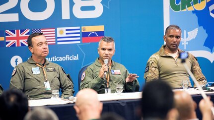 Col. Raul Rosario (center), commander of the 149th Fighter Wing, Air National Guard, participates in an international press panel which included representatives from seven other countries for CRUZEX2018 at Natal Air Force Base, Nov. 19. Approximately 100 international media representatives joined the press conference, hosted by the Brazilian Air Force, to learn about the goals and expectations of the air exercise. The 149th FW commander expressed his gratitude to the host country and for the opportunity to work together as equals to promote peace and safety.
