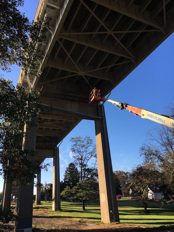 Contractors inspect ongoing repair work of floor beam covers at the St. Georges Bridge in Delaware. Work includes replacement of 45 floor beam covers, more than 7,000 bolts and rivets, and replacement of all deck joint strip seals. Work is expected to be completed around the end of January. St. Georges Bridge was constructed in 1941 and is owned and maintained by the U.S. Army Corps of Engineers.