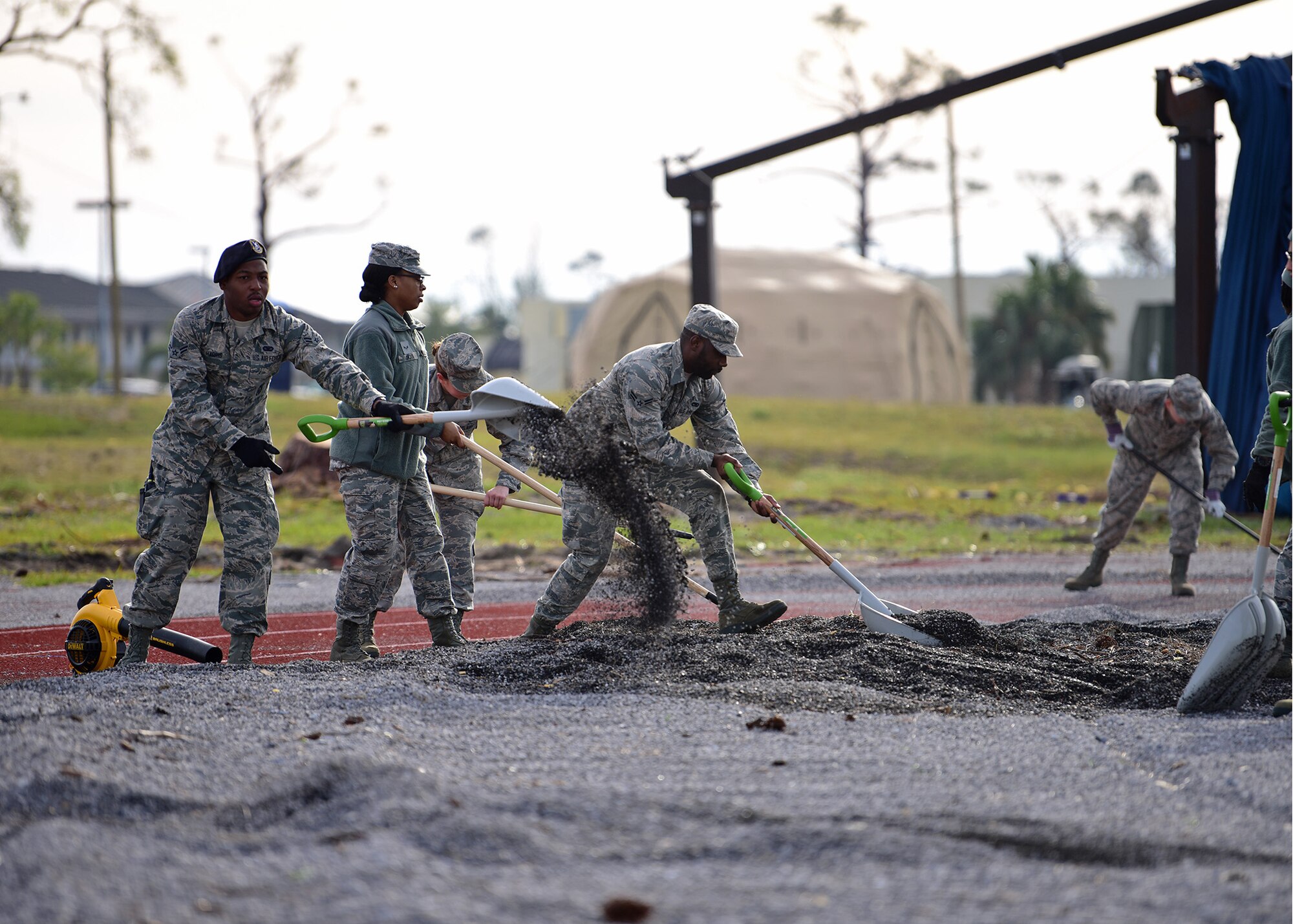 Task Force Talon II Airmen remove gravel from the running track at Tyndall Air Force Base, Fla., Nov. 29, 2018. Task Force Talon II is responsible for clearing debris and cleaning various parts of the base to include parts of the flightline and dormitories. (U.S. Air Force photo by Senior Airman Isaiah J. Soliz)