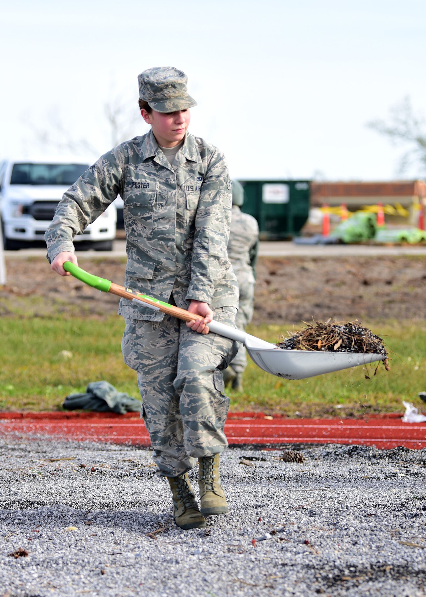 Airman Ashby Foster, Task Force Talon II member, shovels debris from the running track at Tyndall Air Force Base, Fla., Nov. 29, 2018. Task Force Talon II is comprised of Tyndall Airmen and is responsible for clearing debris and cleaning various parts of the base to include parts of the flightline and dormitories. (U.S. Air Force photo by Senior Airman Isaiah J. Soliz)