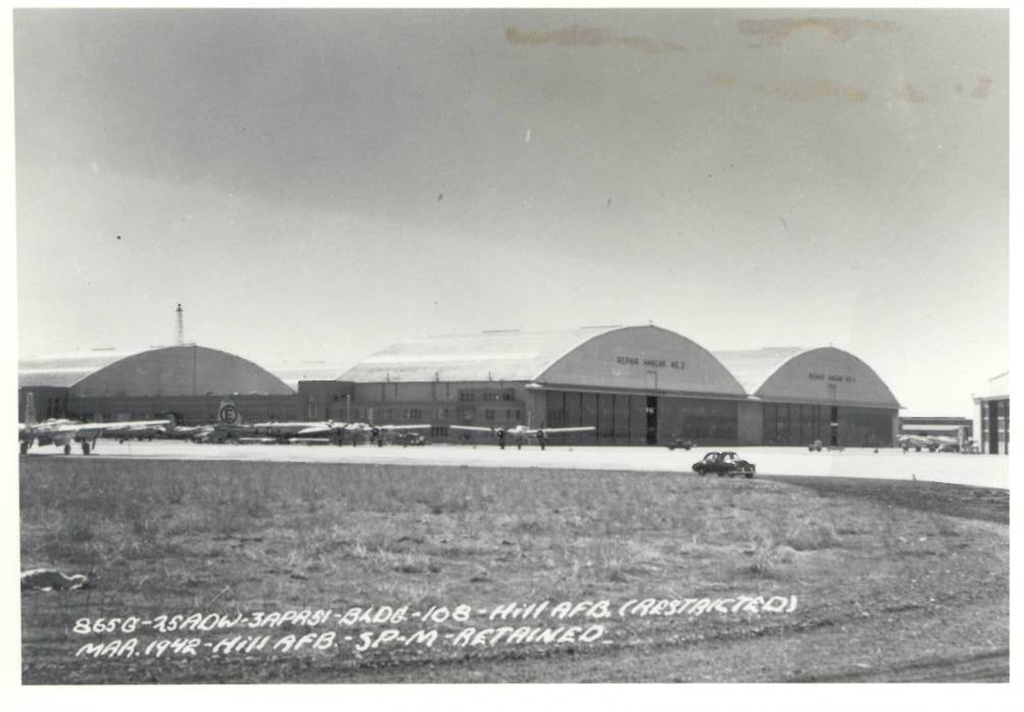 Parked aircraft on the ramp in front of Hangar 225 in March 1942 at Hill Air Force Base, Utah. The 76-year-old structure was built during World War II and is scheduled to undergo an estimated $40 million, six-year renovation project that will repair and replace a deteriorating roof on the nearly 13-acre building. The 309th Aircraft Maintenance Group currently uses the hangar for upgrade, maintenance and repair work on multiple aircraft. (U.S. Air Force)