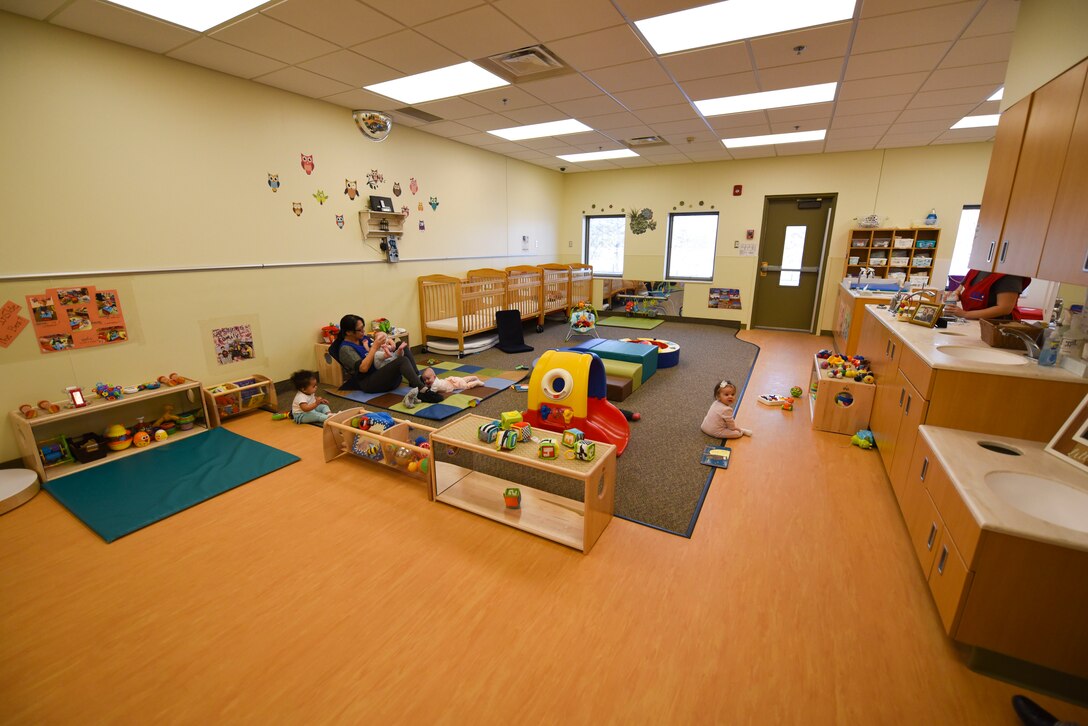 A child care specialist plays "so big" with a baby at the Child Development Center November 27, 2018, on Grand Forks Air Force Base, North Dakota. The CDC spent $280,000 on new furniture and toys, so children have more room for activities and games throughout the day. (U.S. Air Force photo by Airman 1st Class Melody Wolff)