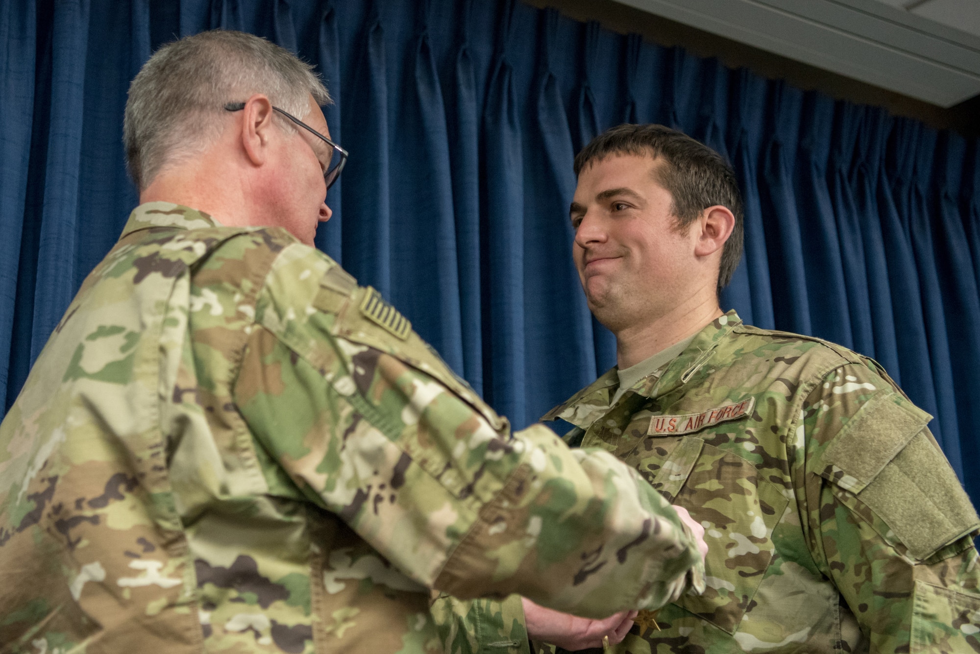 Tech. Sgt. Joshua C. Busch (right), a combat controller for the 123rd Special Tactics Squadron, receives the Bronze Star Medal from Col. David Mounkes, commander of the 123rd Airlift Wing, during a ceremony at the Kentucky Air National Guard Base in Louisville, Ky., Nov. 17, 2018. Busch distinguished himself for meritorious service with his participation in Operations Freedom’s Sentinel and Resolute Support. From February to May 2018, Busch served as a key senior tactical advisor for 17 ground combat operations, leading and coordinating 42 air-to-ground engagements while under enemy fire, directly resulting in 33 enemies killed in action. (U.S. Air National Guard photo by Staff Sgt. Joshua Horton)