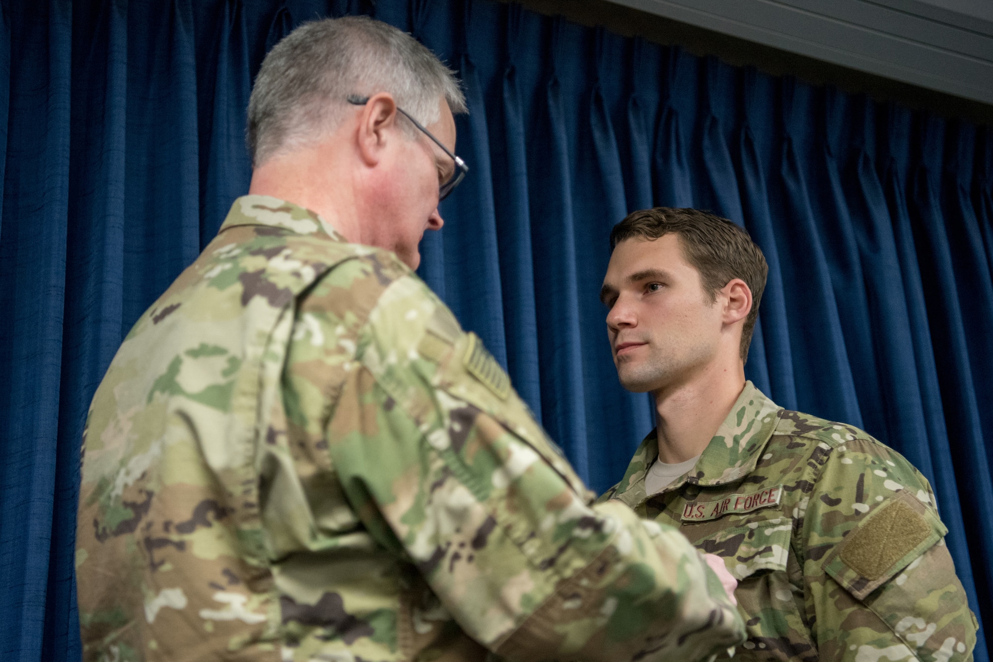 Staff Sgt. Robert W. Willging, a combat controller for the 123rd Airlift Special Tactics Squadron, is pinned with the Bronze Star Medal by Col. David Mounkes, commander of the 123rd Airlift Wing, during a ceremony at the Kentucky Air National Guard Base in Louisville, Ky., Nov. 17, 2018. Willging distinguished himself while engaged against an opposing armed force in July 2017 by displaying disregard for his own personal safety and exposing himself to hostile fire in order to coordinate and control close air support in defense of pinned-down assault elements caught in an ambush. Willging’s performance directly contributed to 81 enemies killed in action, 30 enemies wounded in action, multiple fighting positions destroyed and his team’s overall success and survival, according to the citation. (U.S. Air National Guard photo by Staff Sgt. Joshua Horton)