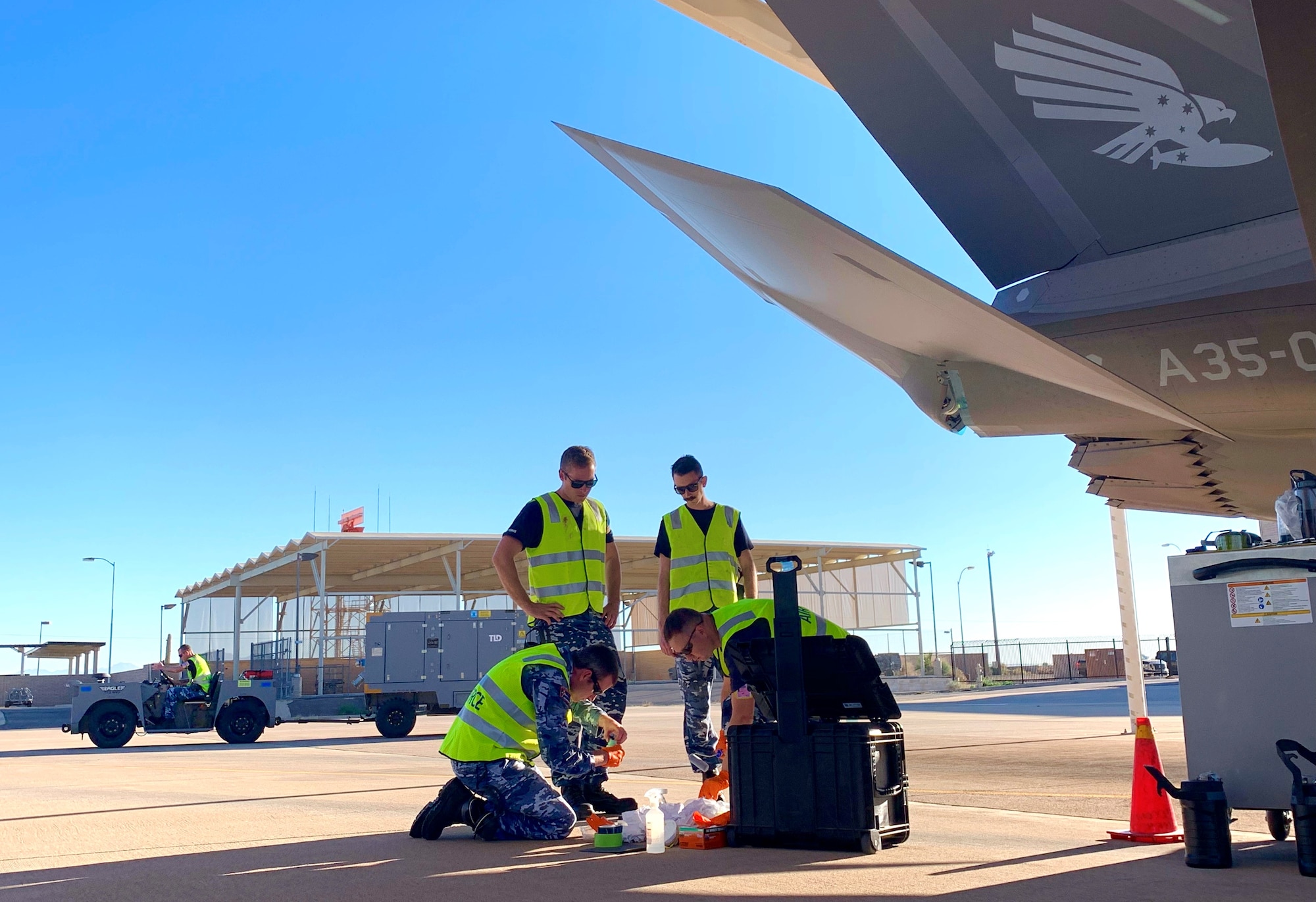 Royal Australian Air Force prepare to perform routine maintenance on an F-35A Lightning II take at Luke AFB Ariz., Nov. 28, 2018. Once completing maintenance, RAAF Airmen have been performing additional tasks over the past two months in preparation to send their first two RAAF F-35s to Australia. (U.S. Air Force photo by Staff Sgt. Jensen Stidham)