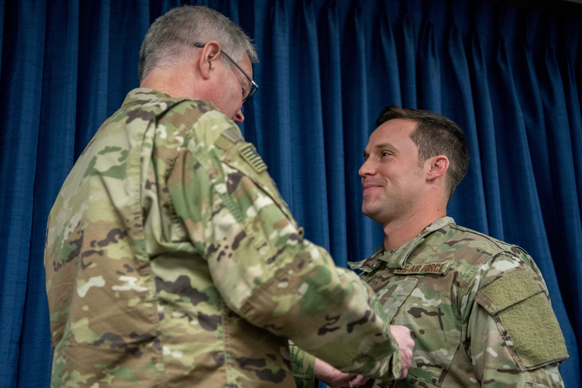 Staff Sgt. Daniel P. Keller (right), a combat controller for the 123rd Special Tactics Squadron, receives the Bronze Star Medal from Col. David Mounkes, commander of the 123rd Airlift Wing, during a ceremony at the Kentucky Air National Guard Base in Louisville, Ky., Nov. 17, 2018. Keller distinguished himself in 2017 for meritorious service in Eastern Afghanistan. His performance resulted in seven medical evacuations of American and partner forces, 209 enemies killed in action, 11 enemies wounded in action, and 163 defensive fighting positions destroyed. (U.S. Air National Guard photo by Staff Sgt. Joshua Horton)