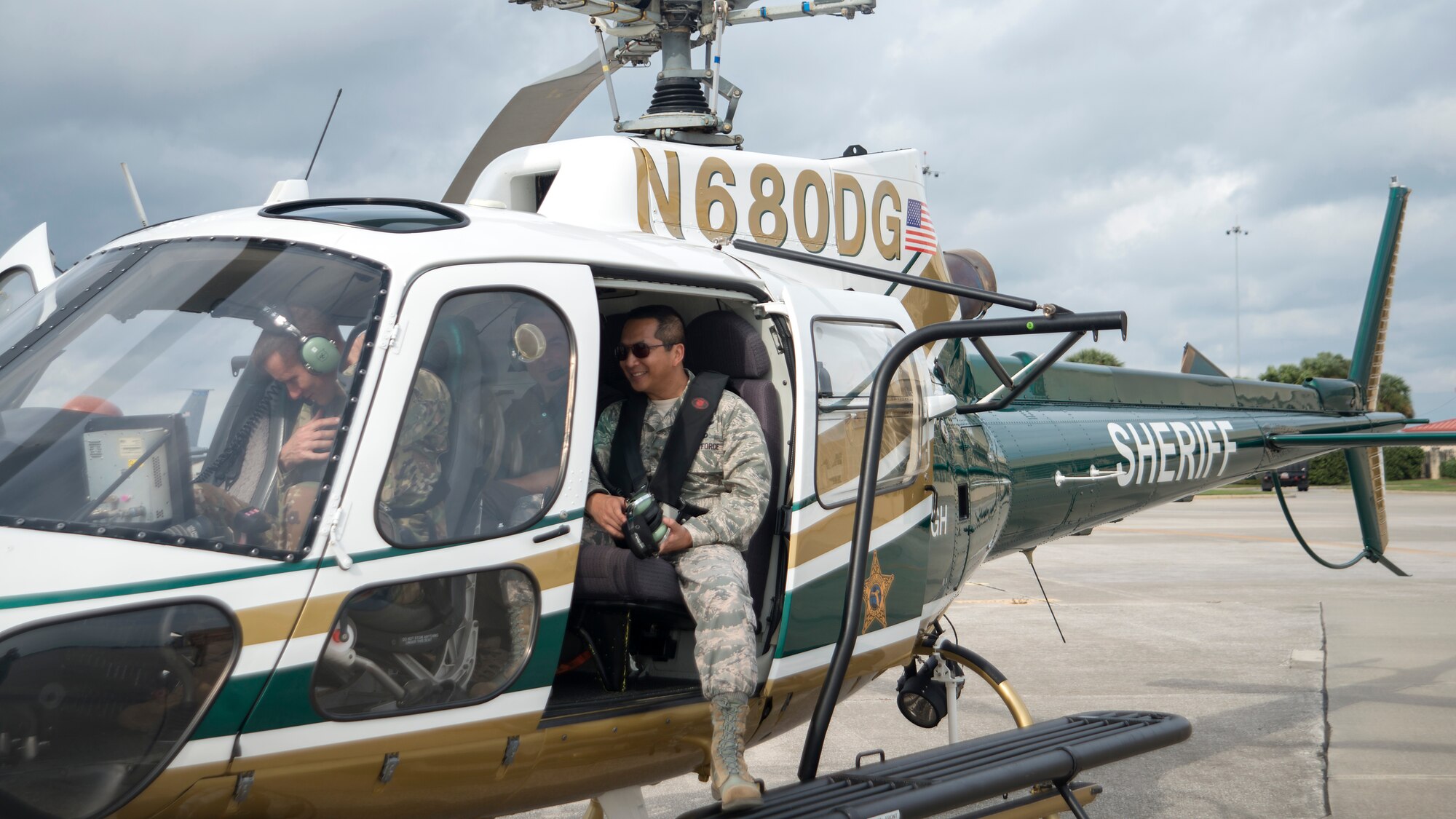 U.S. Air Force Col. Stephen Snelson, left, 6th Air Mobility Wing Commander and Col. Troy Pananon, 6th Air Mobility Wing Vice-Commander, prepare for takeoff in a helicopter at MacDill Air Force Base, Fla., Nov. 26, 2018.