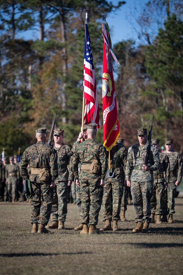 U.S. Marine Corps Col. Boyd A. Miller, right, commanding officer of Combat Logistics Regiment 27, 2nd Marine Logistics Group, and Sgt. Maj. Alex Narvaez, left, sergeant major of CLR-27, 2nd MLG, face the new battle colors of CLR-27 during a re-designation ceremony at Camp Lejeune, North Carolina, Nov. 29, 2018. The unit’s designation was changed from Headquarters Regiment to CLR-27 to focus on warfighting, deployability, and the integration of capabilities required to execute the Marine Corps mission. (U.S. Marine Corps photo by Sgt. Bethanie C. Sahms)