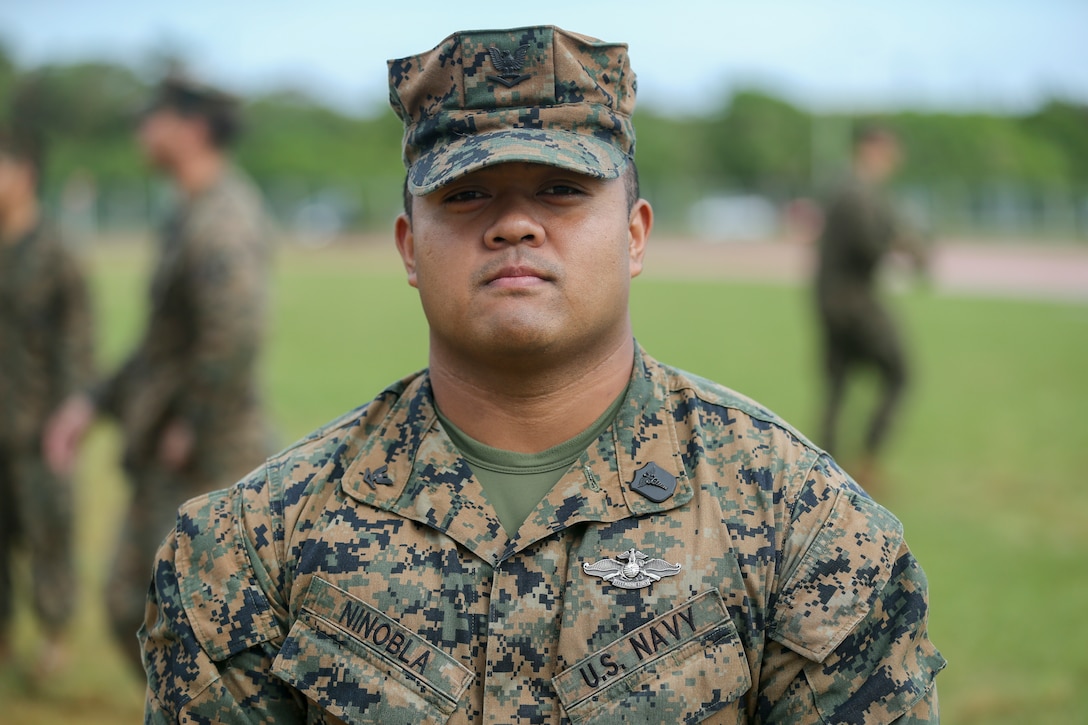 U.S. Navy Hospital Corpsman 3rd Class Alan A. Ninobla III finishes a triage care scenario with fellow Sailors from the Camp Kinser Dental clinic Nov. 16, 2018 on Camp Hansen, Okinawa, Japan. Sailors from dental clinics on Okinawa participated in Tactical Casualty Care to reinforce the basics of triage care for personnel involved in combat operations with support from Sailors with 3rd Medical Battalion. The various scenarios were chosen to depict common injuries that are seen during deployments. Ninobla, a native of Porterville, California, is a corpsman with 3rd Dental Battalion, 3rd Marine Logistics Group. (U.S. Marine Corps photo by Lance Cpl. Armando Elizalde)