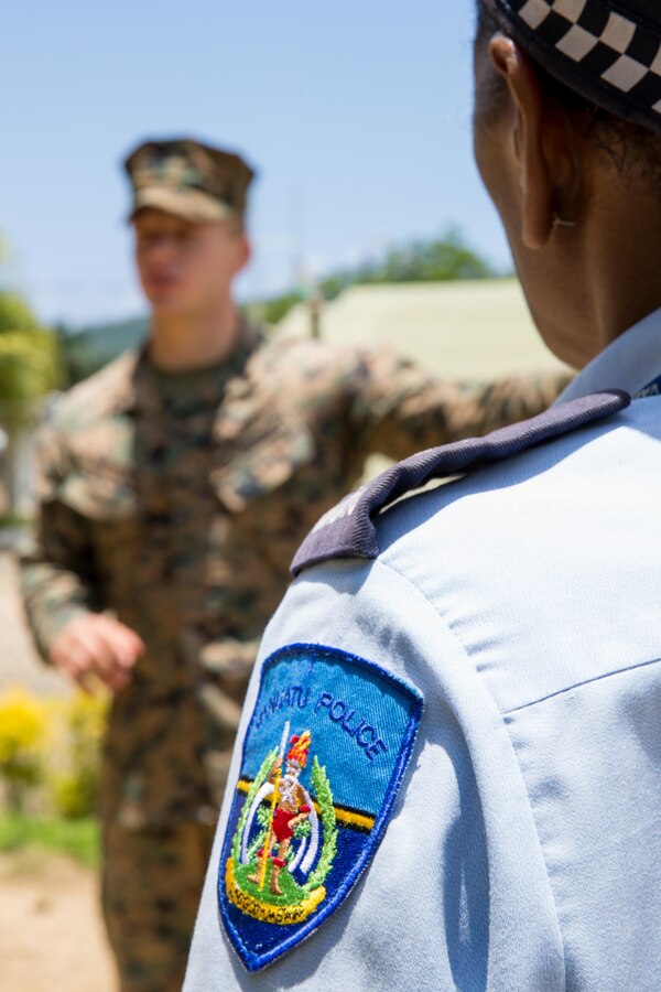 A member of the Vanuatu Police Force listens as U.S. Marine Corps Sgt. Johnathan Watkins, left, a ground radio repairman with Task Force Koa Moana, conducts a square loop antenna practical application at Port Vila, Efate Island, Republic of Vanuatu, Nov. 15, 2018. The Task Force exchanged radio communication capabilities with Vanuatu radio communicators in case of a humanitarian assistance and disaster and relief crises, as part of the Task Force’s continued multilateral engagements designed to strengthen and enhance relationships among the United States and partner nations in the Indo-Pacific and South Pacific regions. (U.S. Marine Corps photo by Staff Sgt. Gabriela Garcia)