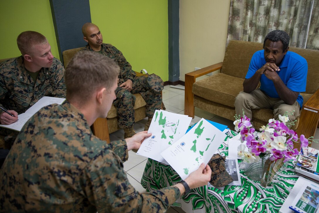 U.S. Marines with Task Force Koa Moana, meet with Abraham Nasak, the director for the Vanuatu National Disaster Management Office to exchange humanitarian assistance and disaster and relief procedures at Port Vila, Efate Island, Republic of Vanuatu, Nov. 12, 2018. Task Force Koa Moana interacts with partner nations to build upon shared tactics, techniques and procedures that enhance readiness and capabilities ahead of real-world challenges.  Approximately 130 U.S. Marines and Sailors with the I Marine Expeditionary Force are participating in security cooperation events with several Oceania partner nations in the U.S. Indo-Pacific Command area of responsibility while embarked on the USNS Stockham (T-AK 3017) from October November to December 2018 as part of Task Force Koa Moana. (U.S. Marine Corps photo by Staff Sgt. Gabriela Garcia)