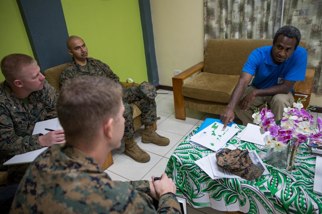 U.S. Marines with Task Force Koa Moana, meet with Abraham Nasak, the director for the Vanuatu National Disaster Management Office to exchange humanitarian assistance and disaster and relief procedures at Port Vila, Efate Island, Republic of Vanuatu, Nov. 12, 2018. Task Force Koa Moana interacts with partner nations to build upon shared tactics, techniques and procedures that enhance readiness and capabilities ahead of real-world challenges.  Approximately 130 U.S. Marines and Sailors with the I Marine Expeditionary Force are participating in security cooperation events with several Oceania partner nations in the U.S. Indo-Pacific Command area of responsibility while embarked on the USNS Stockham (T-AK 3017) from October November to December 2018 as part of Task Force Koa Moana. (U.S. Marine Corps photo by Staff Sgt. Gabriela Garcia)