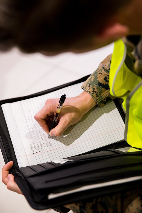 U.S. Marine Corps Sgt. Kodi Kilcoin, an anti-terrorism force protection specialist with Task Force Koa Moana, writes notes during an airport survey at the Bauerfield International Airport, Port Vila, Efate Island, Republic of Vanuatu, Nov. 15, 2018. The Task Force conducted logistical surveys in case of a humanitarian assistance and disaster and relief crises as part of the Task Force’s continued multilateral engagements designed to strengthen and enhance relationships among the United States and partner nations in the Indo-Pacific and South Pacific regions. (U.S. Marine Corps photo by Staff Sgt. Gabriela Garcia)