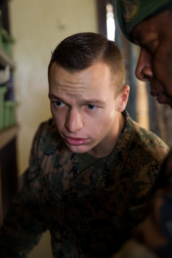 U.S. Marine Corps Sgt. Johnathan Watkins, left, a ground radio repairman with Task Force Koa Moana, looks at various radios with Vanuatu Mobile Force (VMF) Corporal Willie T. Waiwo, a communications technician, at Port Vila, Efate Island, Republic of Vanuatu, Nov. 14, 2018. The Task Force met with the VMF to learn their radio communication capabilities in case of a humanitarian assistance and disaster and relief crises, as part of the Task Force’s continued multilateral engagements designed to strengthen and enhance relationships among the United States and partner nations in the Indo-Pacific and South Pacific regions. Approximately 130 U.S. Marines and Sailors with the I Marine Expeditionary Force are participating in security cooperation events with several Oceania partner nations in the U.S. Indo-Pacific Command area of responsibility while embarked on the USNS Stockham (T-AK 3017) from October November to December 2018 as part of Task Force Koa Moana. (U.S. Marine Corps photo by Staff Sgt. Gabriela Garcia)