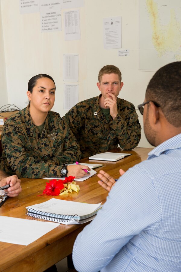 U.S. Marine Corps Capt. Christopher Coulon, right, a civil affairs officer, and U.S. Navy Hospital Corpman 2nd Class Desirae A. Montoya, both with Task Force Koa Moana, listen to Dr. Sam Tapo, a chair of the health cluster, national incident controller, the director of coporate service planning and policy, and a member of the World Health Organization (WHO), at Port Vila, Efate Island, Republic of Vanuatu, Nov. 14, 2018. The Task Force met with Tapo and other WHO members to learn more about the organization, how they handle, and exchange humanitarian assistance and disaster and relief procedures in case of a crises as part of the Task Force’s continued multilateral engagements designed to strengthen and enhance relationships among the United States and partner nations in the Indo-Pacific and South Pacific regions. (U.S. Marine Corps photo by Staff Sgt. Gabriela Garcia)