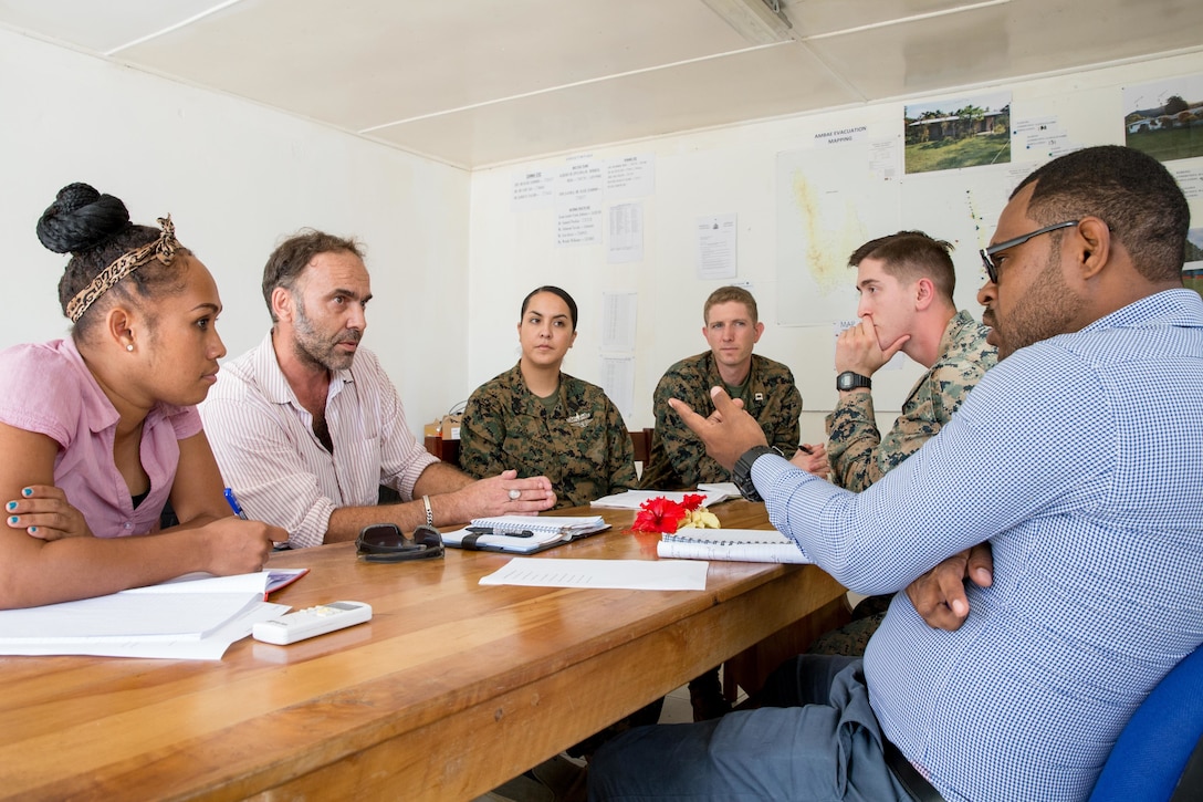 U.S. Marine Corps Capt. Christopher Coulon, third from right, a civil affairs officer, U.S. Navy Hospital Corpman 2nd Class Desirae A. Montoya, third from left, and Sgt. Kodi Kilcoin, second from right, a anti-terrorism force protection agent, all with Task Force Koa Moana, meet with members of the World Health Organization (WHO) at Port Vila, Efate Island, Republic of Vanuatu, Nov. 14, 2018. The Task Force met with WHO members to learn more about the organization, how they handle, and exchange humanitarian assistance and disaster and relief procedures in case of a crises as part of the Task Force’s continued multilateral engagements designed to strengthen and enhance relationships among the United States and partner nations in the Indo-Pacific and South Pacific regions. (U.S. Marine Corps photo by Staff Sgt. Gabriela Garcia)