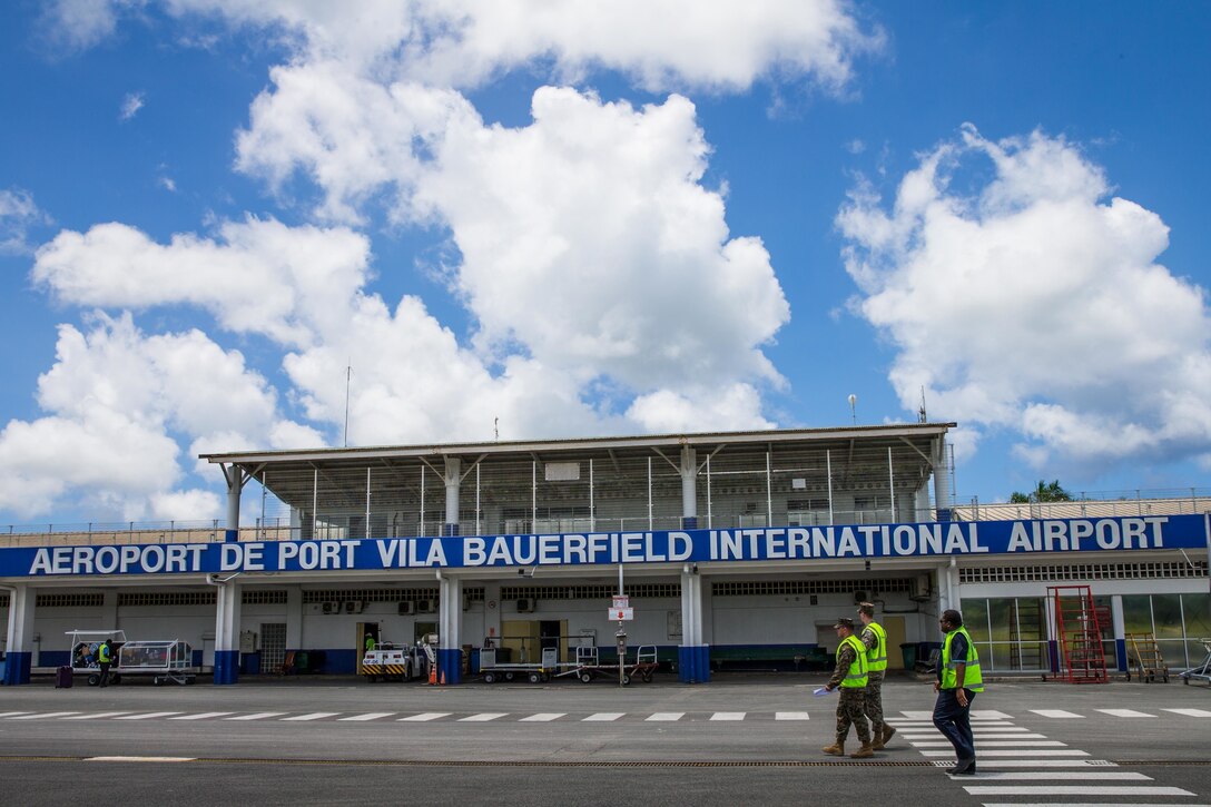 U.S. Marines Sgt. Kodi Kilcoin, top, an anti-terrorism force protection specialist, and Staff Sgt. Tyler Strawser, center, an engineer detachment platoon guide, both with Task Force Koa Moana, conduct an airport survey at the Bauerfield International Airport, Port Vila, Efate Island, Republic of Vanuatu, Nov. 15, 2018. The Task Force conducted logistical surveys in case of a humanitarian assistance and disaster and relief crises as part of the Task Force’s continued multilateral engagements designed to strengthen and enhance relationships among the United States and partner nations in the Indo-Pacific and South Pacific regions. (U.S. Marine Corps photo by Staff Sgt. Gabriela Garcia)