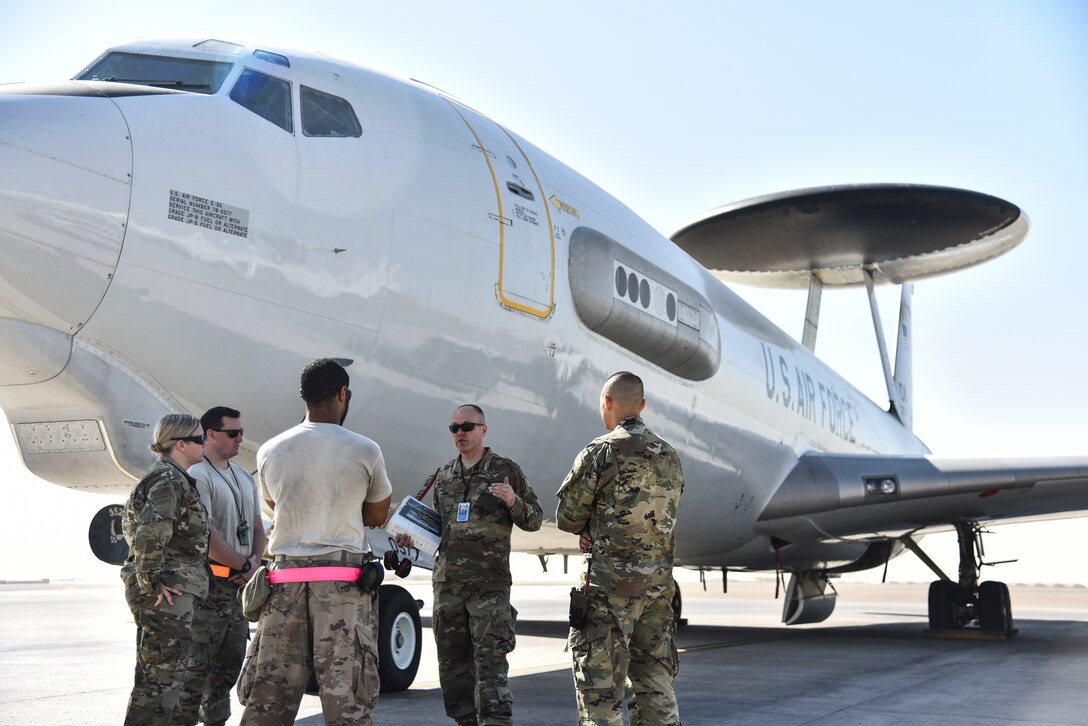 380th Expeditionary Maintenance Group Crash Damaged or Disabled Aircraft Recovery team members participate in familiarization training on an E-3 Sentry AWACS at Al Dhafra Air Base, United Arab Emirates, Nov. 14, 2018. The CDDAR team is not only responsible for responding to the aircraft assigned to ADAB, but all aircraft in the U.S. Air Forces Central Command area of responsibility. The AFCENT AOR ranges from the top of Uzbekistan near the Aral Sea, all the way to the southern tip of Yemen – spanning across 20 Central and Southwest Asian countries. (U.S. Air Force photo by Senior Airman Mya M. Crosby)