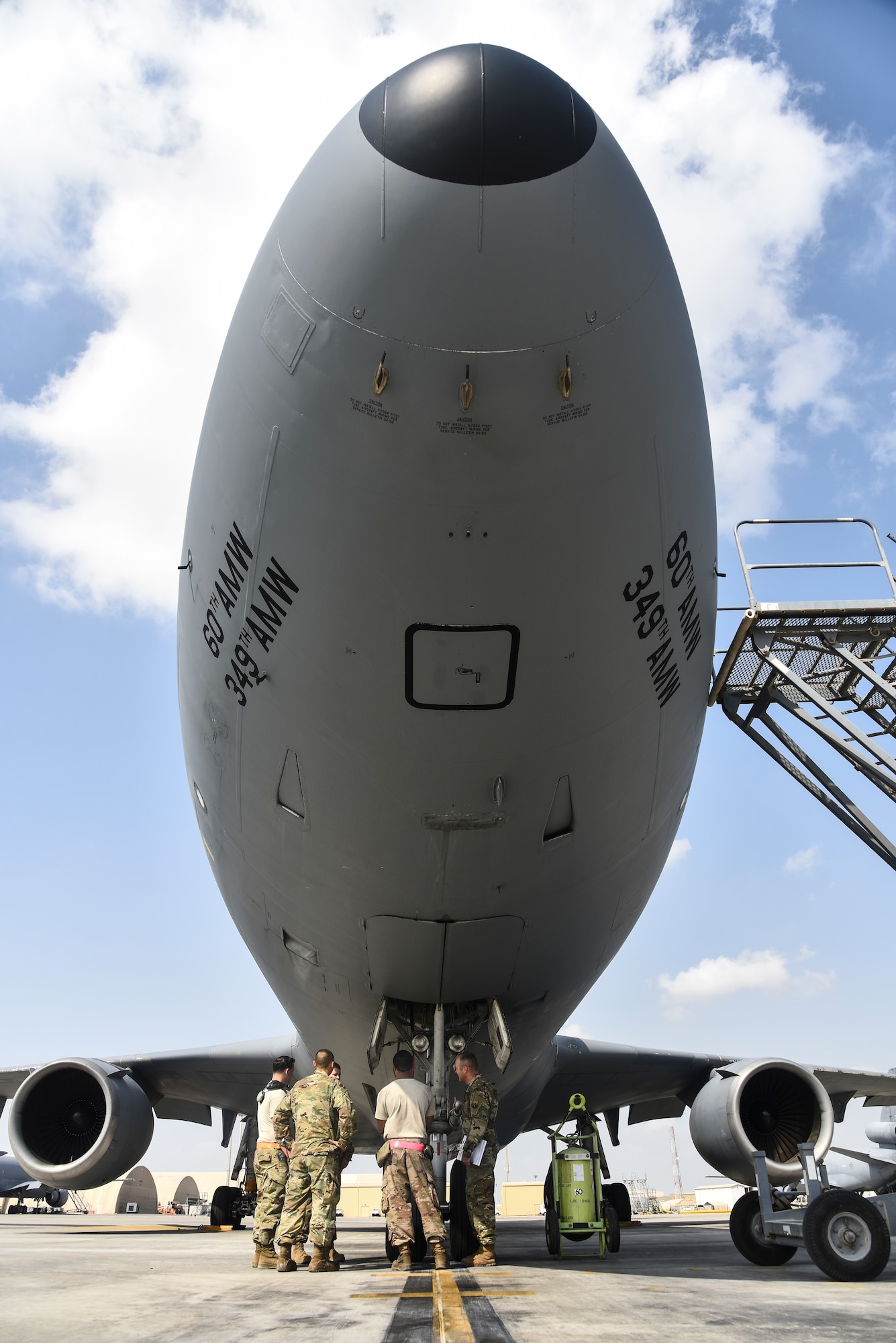 380th Expeditionary Maintenance Group Crash Damaged or Disabled Aircraft Recovery team members participate in familiarization training on a KC-10 Extender at Al Dhafra Air Base, United Arab Emirates, Nov. 21, 2018. The CDDAR team is not only responsible for responding to the aircraft assigned to ADAB, but all aircraft in the U.S. Air Forces Central Command area of responsibility. The AFCENT AOR ranges from the top of Uzbekistan near the Aral Sea, all the way to the southern tip of Yemen – spanning across 20 Central and Southwest Asian countries. (U.S. Air Force photo by Senior Airman Mya M. Crosby)