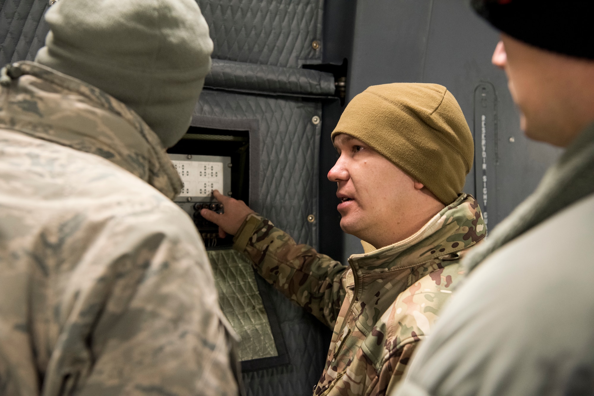 Staff Sgt. Brett Anger, 521st Air Mobility Operations Wing regional training center electrical environmental systems instructor, explains the anti-skid test controller to students aboard a C-5M Super Galaxy aircraft at Ramstein Air Base, Germany, Nov. 29, 2018. Nearly 60 aircraft maintainers and 30 aerial port personnel trained on the aircraft, assigned to the 436th Airlift Wing in Dover, Del., during a first-of-its-kind training session held Nov. 26 – Dec. 7. (U.S. Air Force photo by Staff Sgt. Aaron J. Jenne)