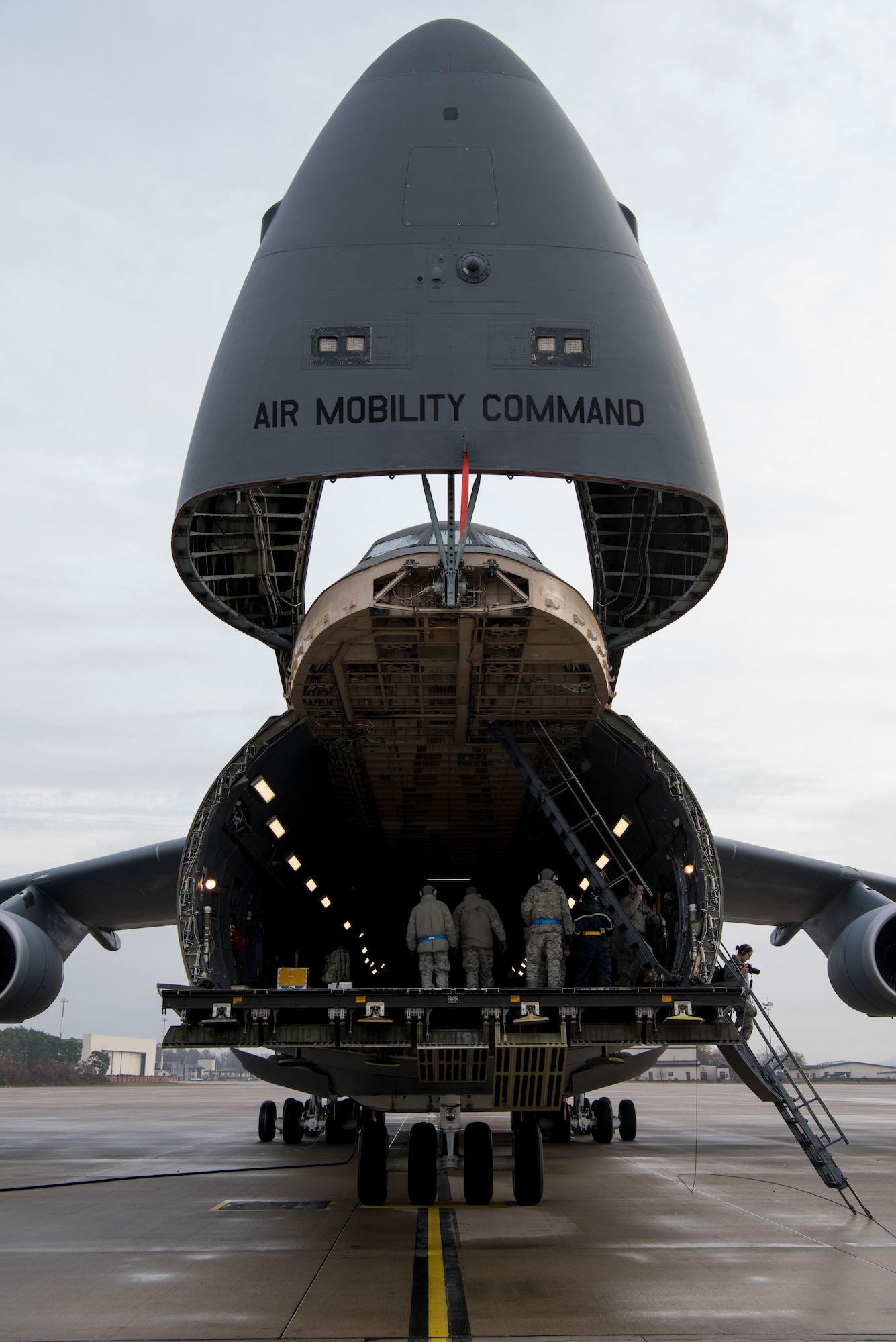 Airmen assigned to the 521st Air Mobility Operations Wing headquartered at Ramstein Air Base, Germany, learn how to operate and maintain a ramp aboard a C-5M Super Galaxy aircraft at Ramstein AB, Nov. 29, 2018. The 521st AMOW has more than 2,100 personnel spread out across nearly 20 geographically separated units throughout Europe and the Middle East. (U.S. Air Force photo by Staff Sgt. Aaron J. Jenne)