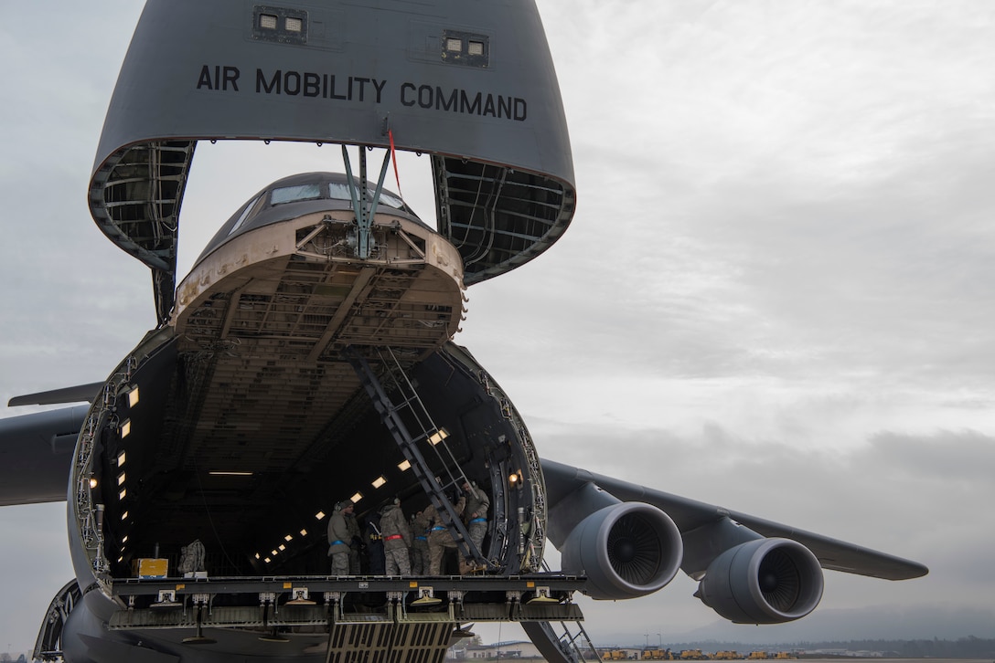 Airmen assigned to the 521st Air Mobility Operations Wing headquartered at Ramstein Air Base, Germany, learn how to operate and maintain a ramp aboard a C-5M Super Galaxy aircraft at Ramstein AB, Nov. 29, 2018. The 521st AMOW has more than 2,100 personnel spread out across nearly 20 geographically separated units throughout Europe and the Middle East. (U.S. Air Force photo by Staff Sgt. Aaron J. Jenne)